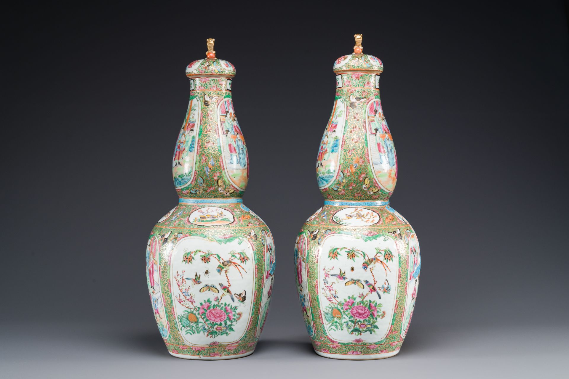 A pair of Chinese Canton famille rose double gourd vases and covers, 19th C. - Image 4 of 6