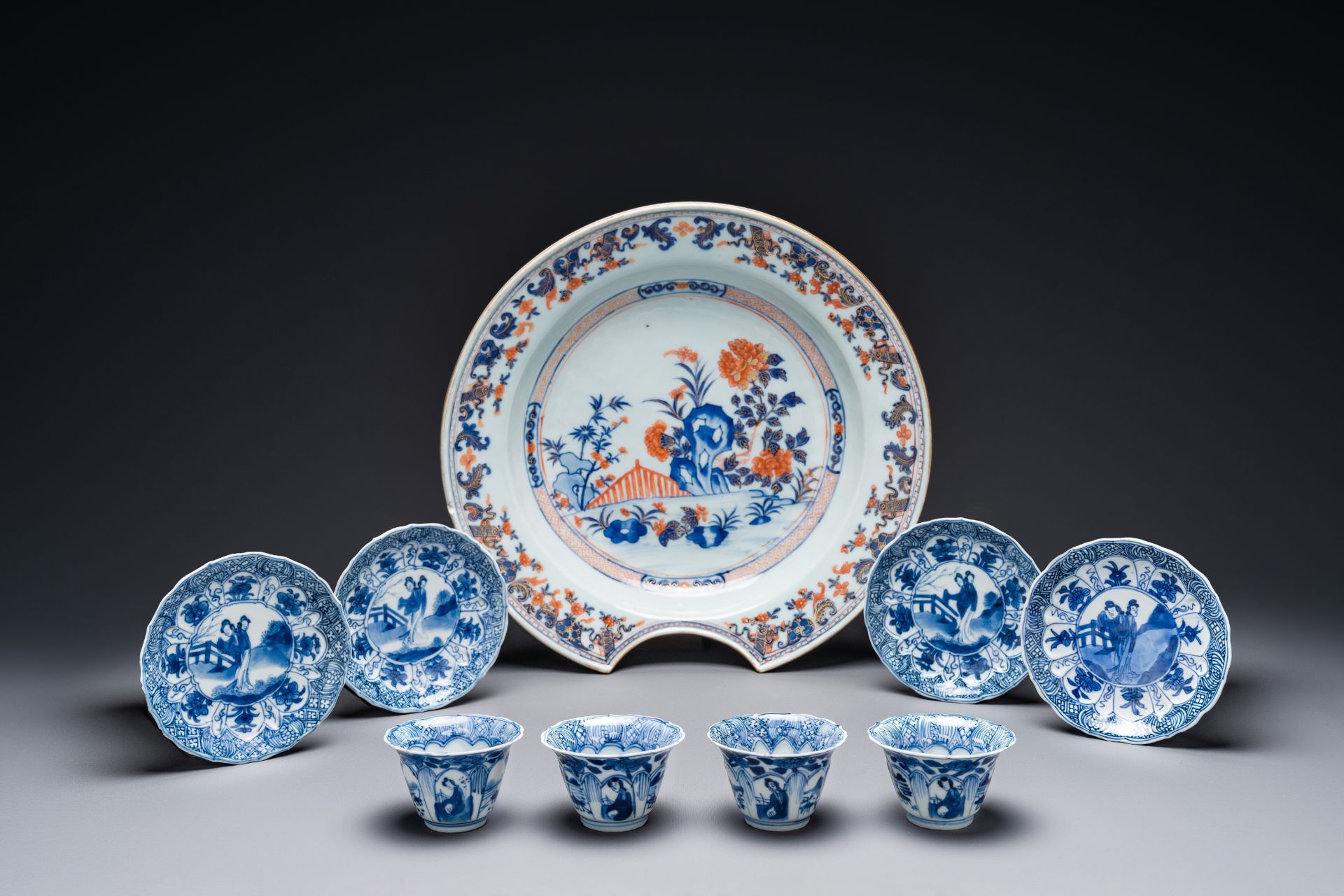 Four Chinese blue and white cups and saucers and a Chinese Imari-style shaving bowl, Kangxi Qianlong