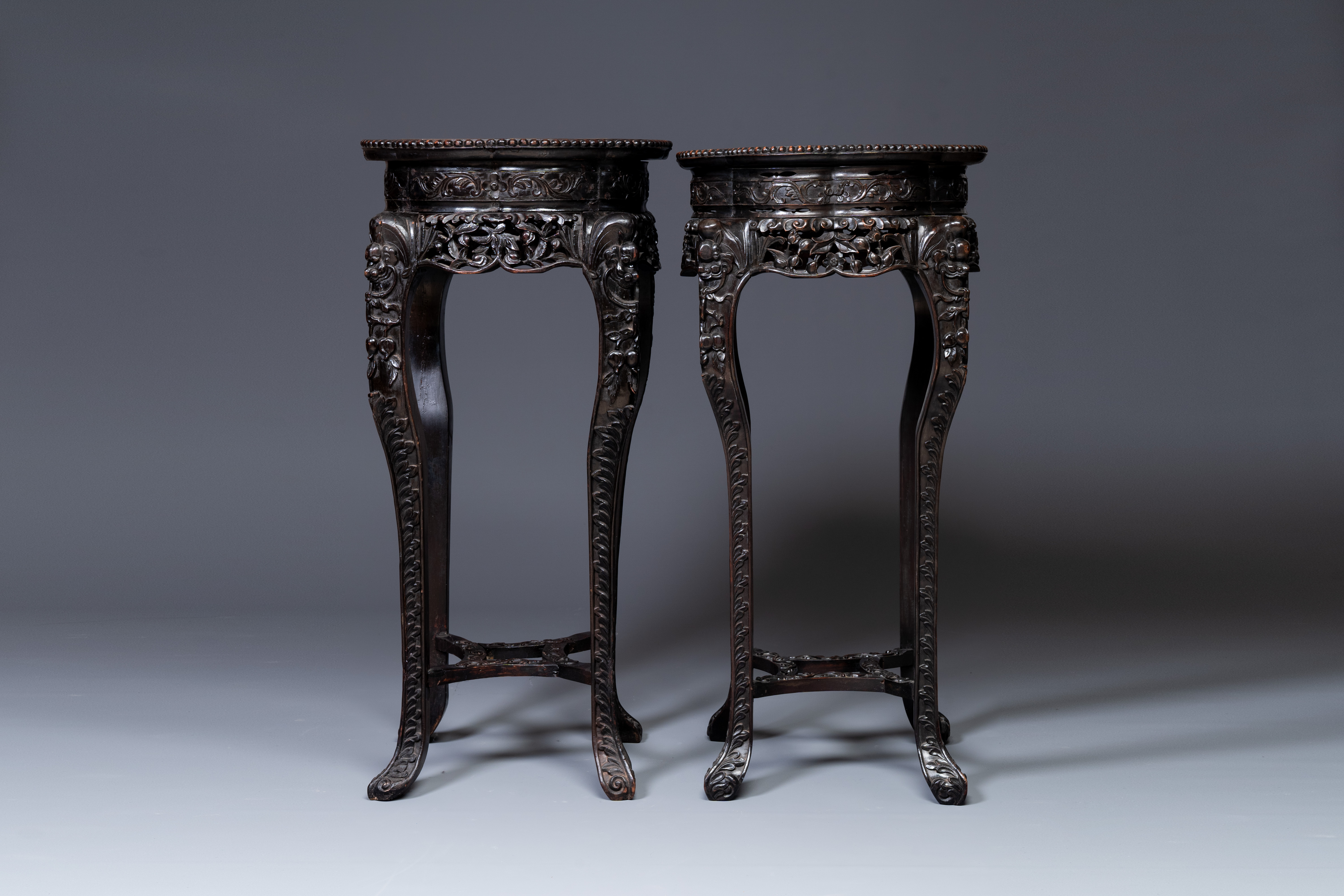 A pair of tall Chinese carved wooden stands with marble tops, 19th C. - Image 3 of 5