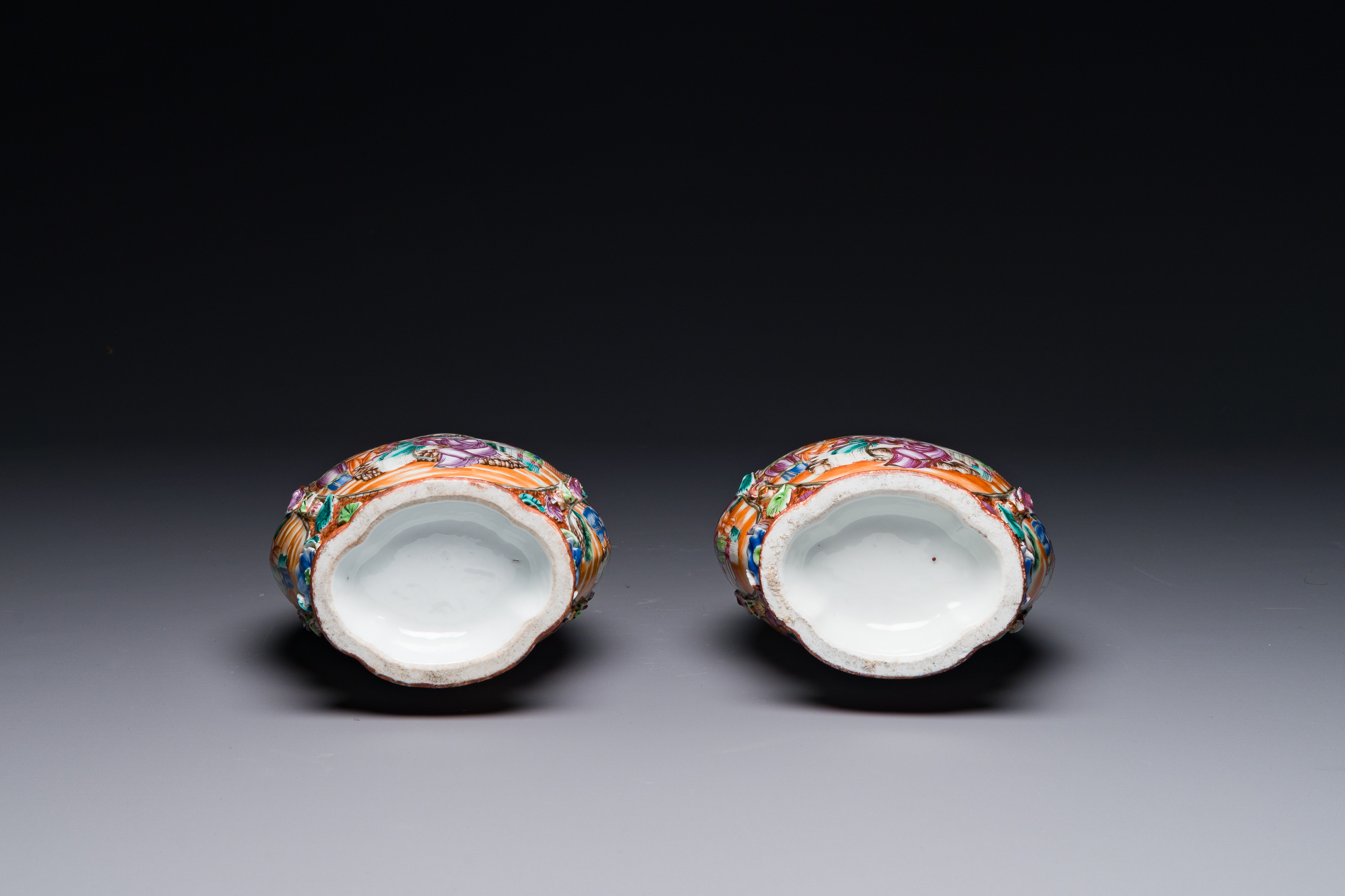 A pair of Chinese Canton famille rose 'mandarin subject' vases with floral relief design, Qianlong - Image 6 of 6