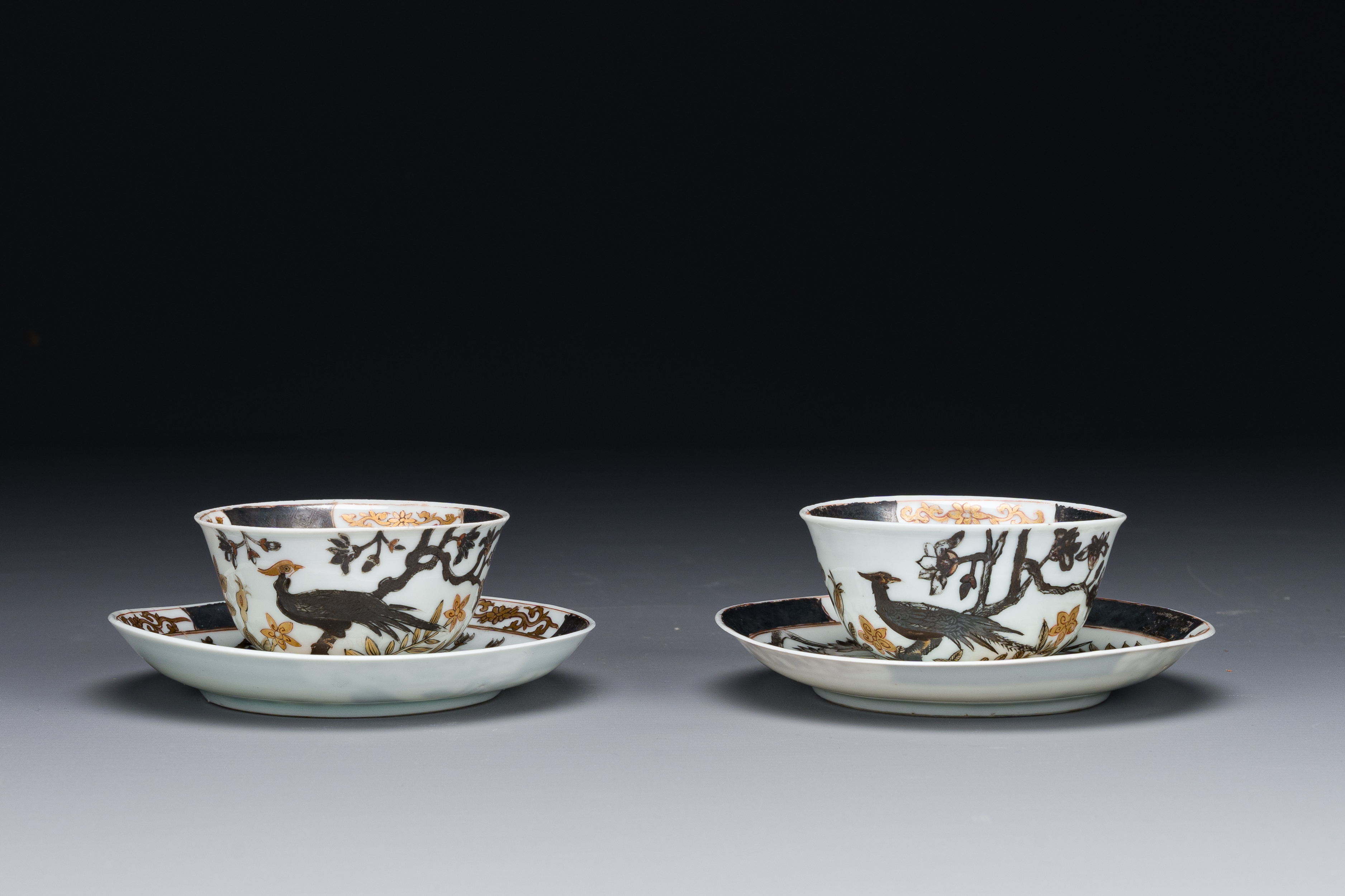 A pair of Chinese grisaille and gilded 'pheasant' cups and saucers, Yongzheng - Image 2 of 4