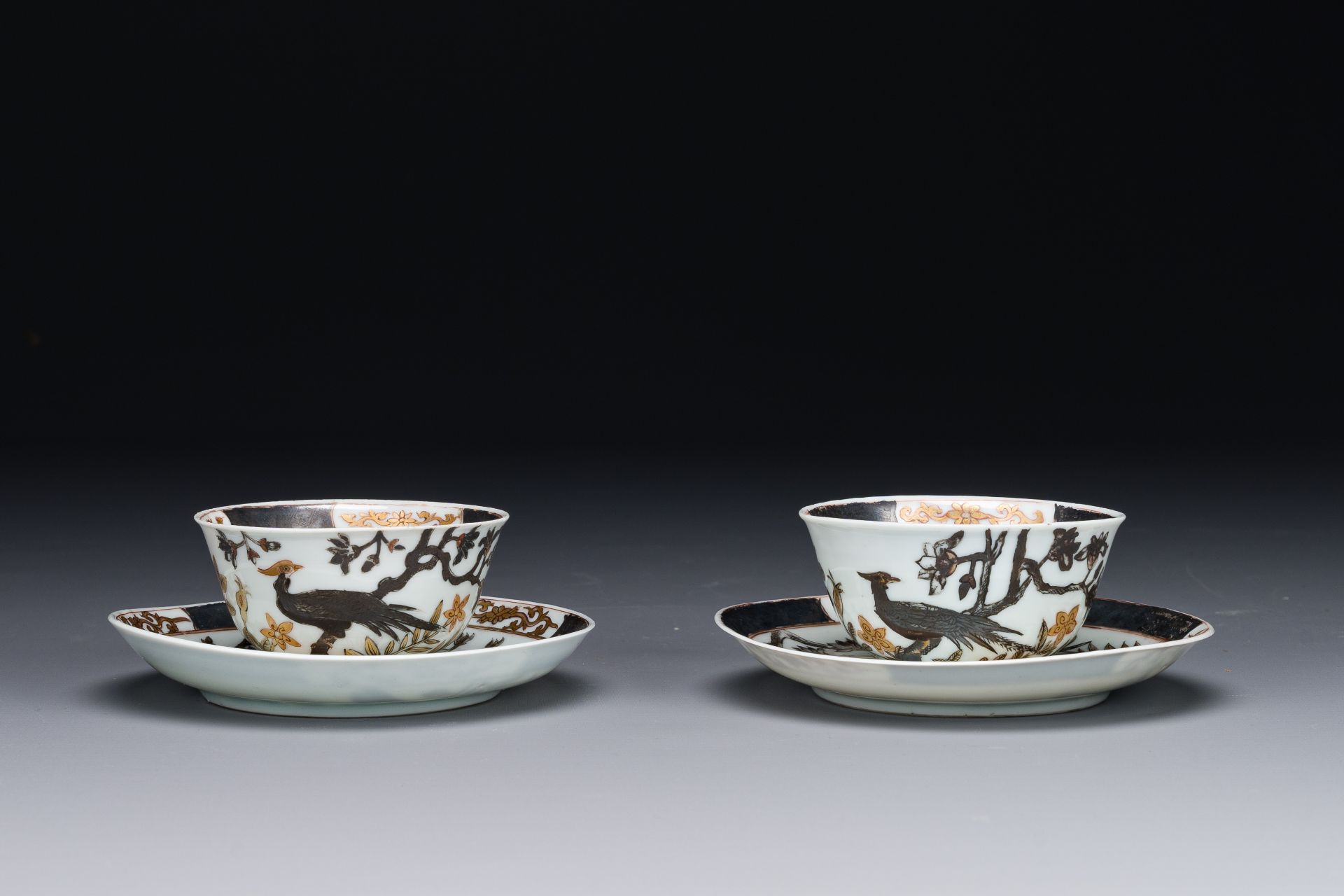 A pair of Chinese grisaille and gilded 'pheasant' cups and saucers, Yongzheng - Image 2 of 4