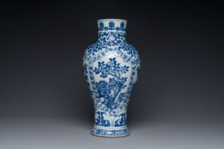 A Chinese blue and white baluster vase with floral decor, Kangxi