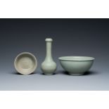 A Chinese celadon-glazed bottle vase and two bowls, Yuan/Ming