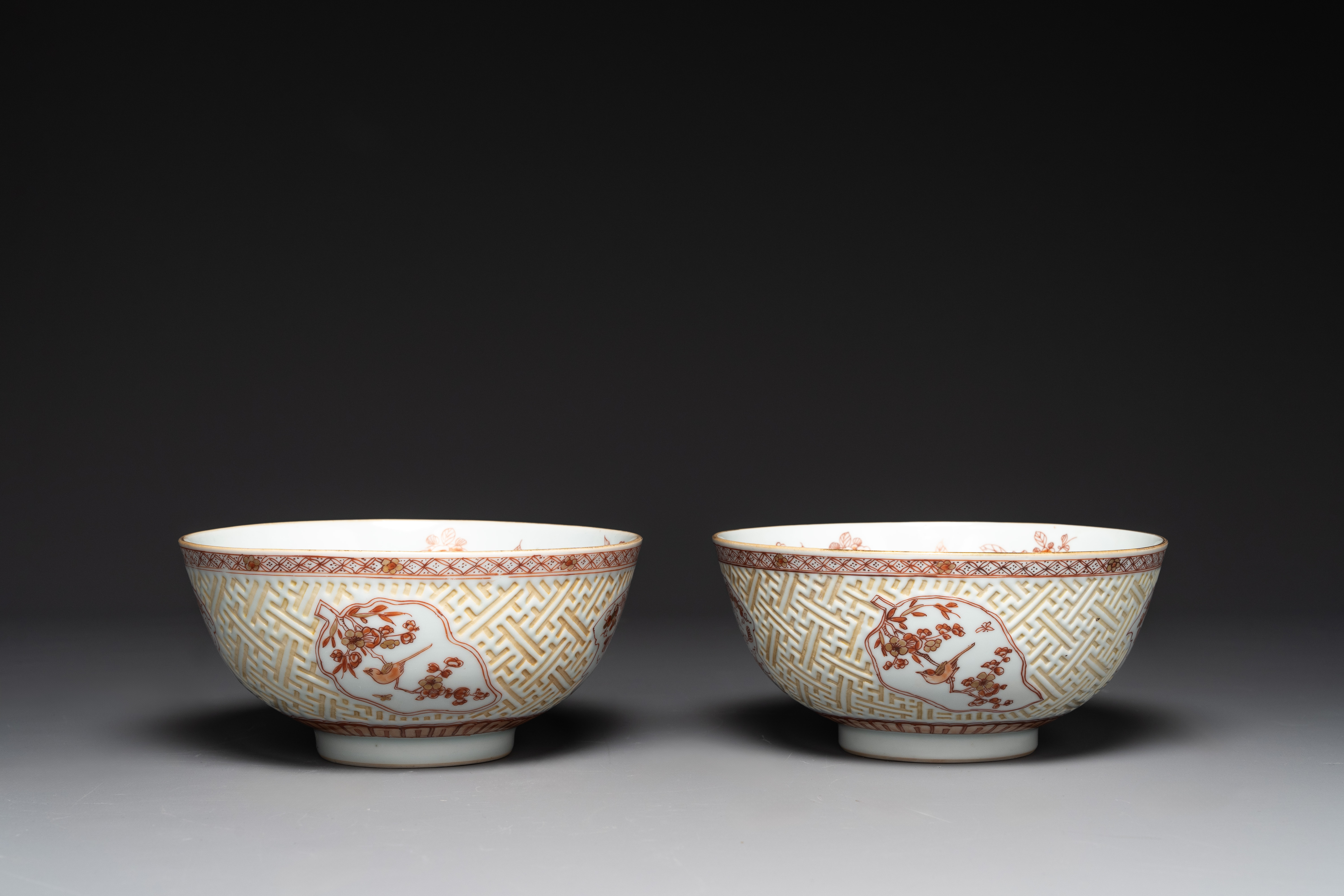 A pair of Chinese iron-red-decorated and gilt bowls with relief design, Kangxi - Image 6 of 8