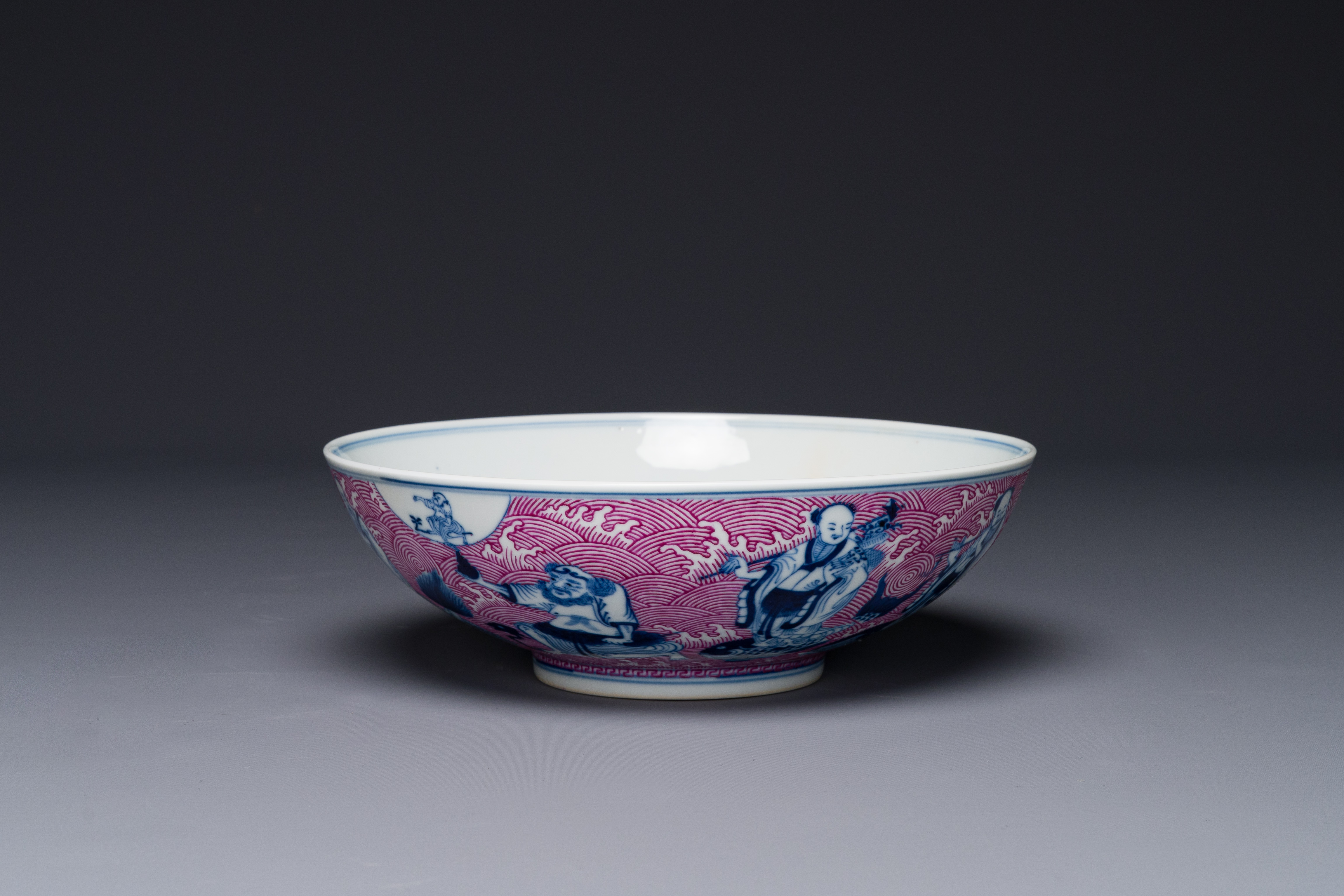 A Chinese blue, white and puce-enamelled 'Eight Immortals' bowl, Guangxu mark and of the period - Image 3 of 8
