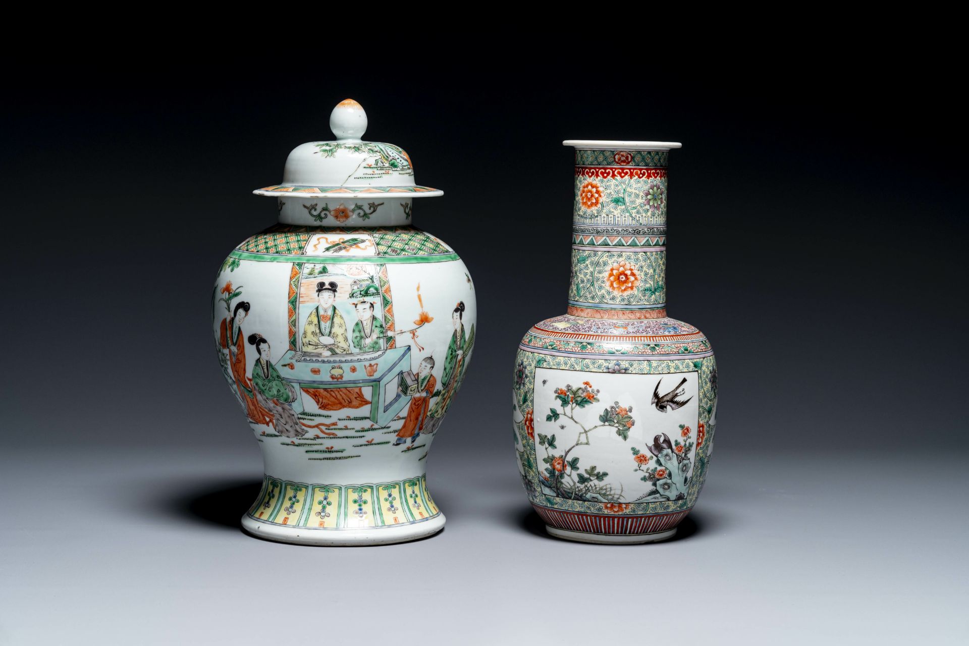 A Chinese famille verte covered vase and a bottle vase, 19th C.