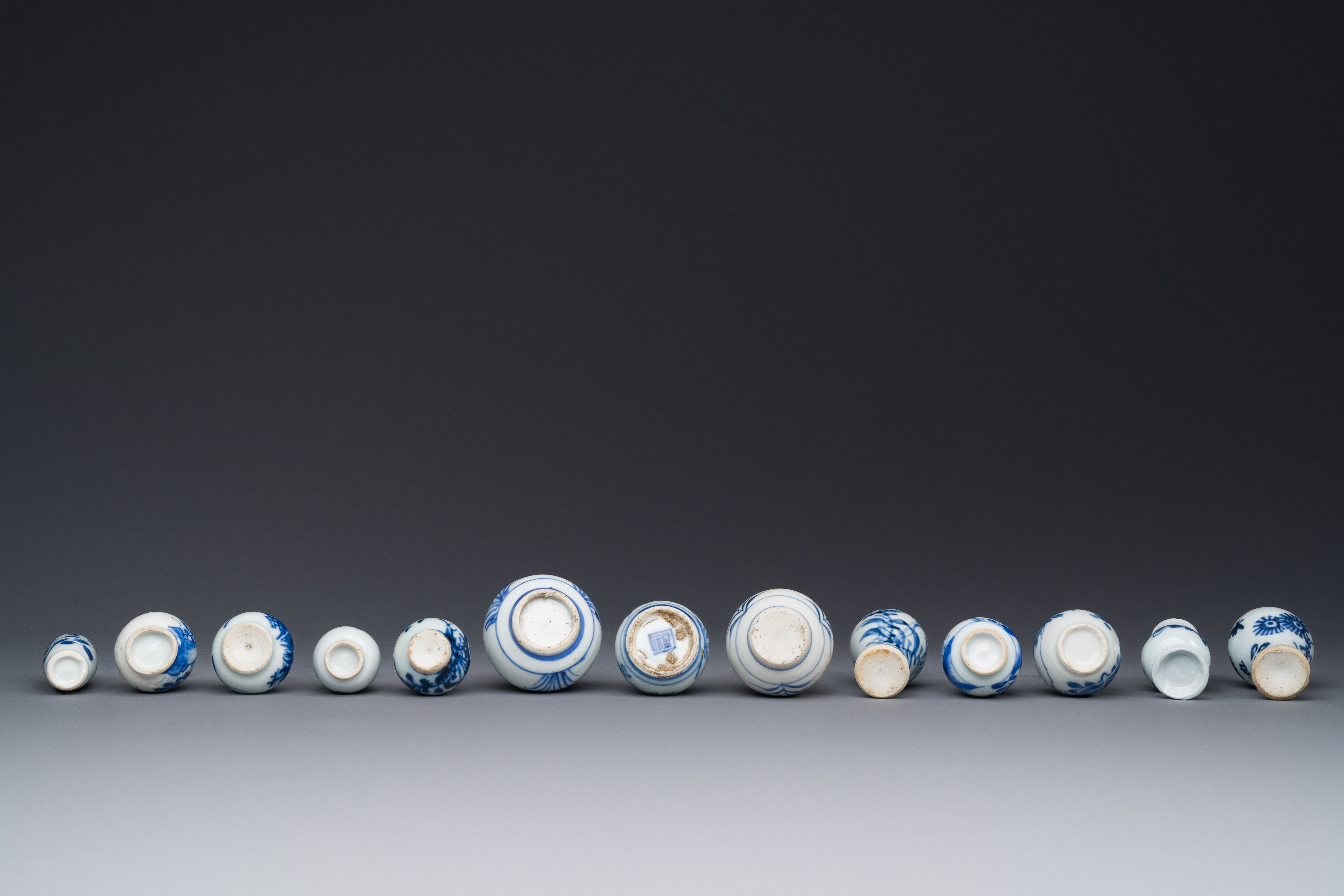 Thirteen Chinese blue and white miniature vases with floral design, Kangxi - Image 5 of 5