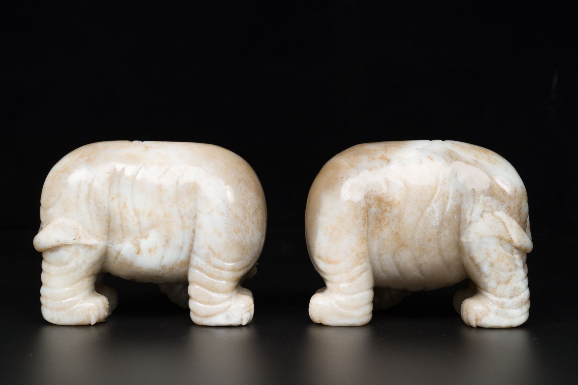 A pair of Chinese white and russet jade sculptures of elephants, Qianlong - Image 6 of 9