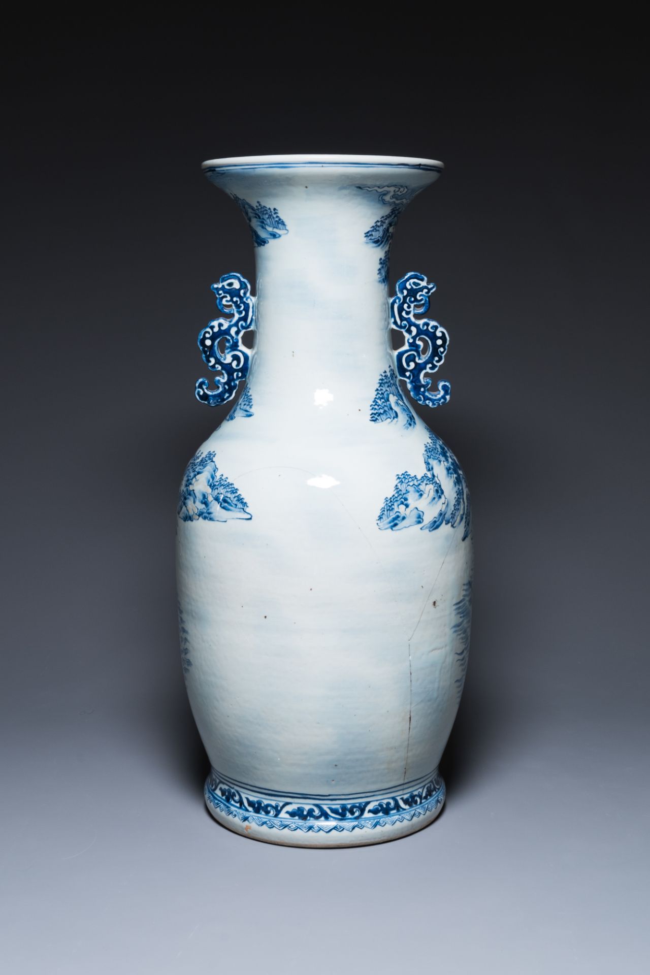 A large Chinese blue, white and copper-red vase with a mountainous river landscape, 19th C. - Image 3 of 6