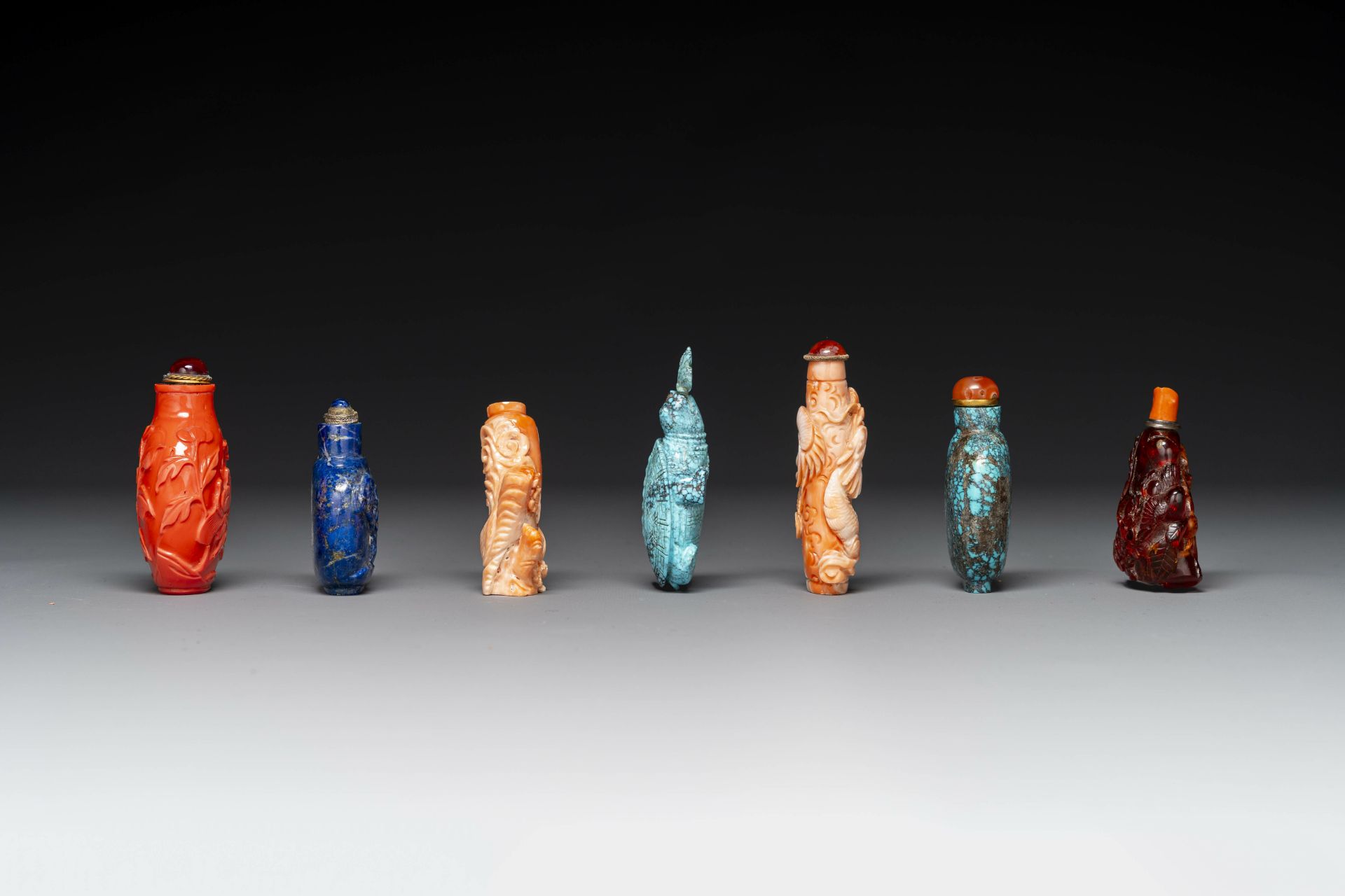Seven varied Chinese snuff bottles of precious stone, red coral, glass and amber, 19th C. - Image 2 of 7
