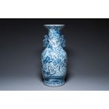 A large Chinese blue, white and copper-red vase with a mountainous river landscape, 19th C.