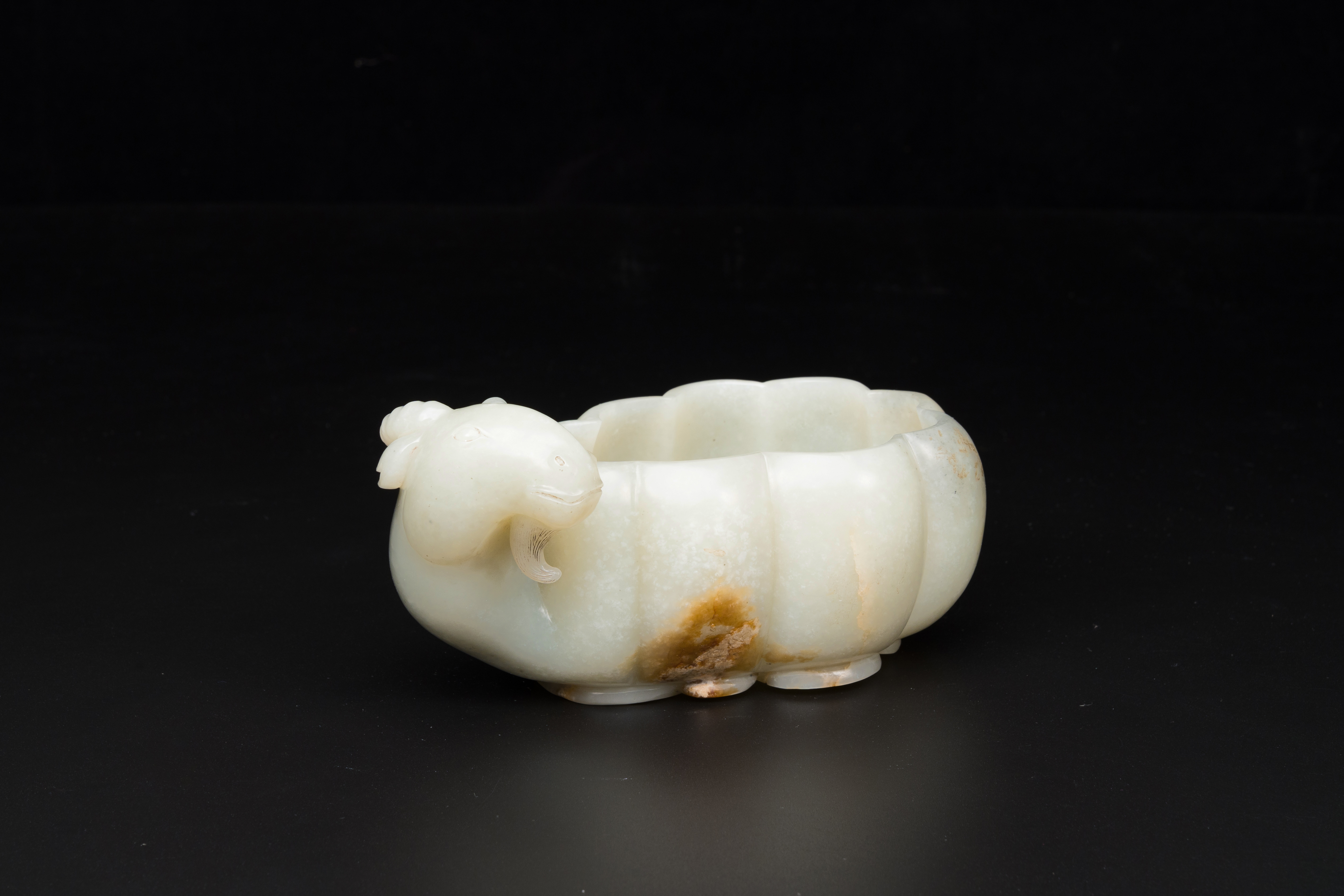 A Chinese celadon jade flower-shaped brush washer with ram's head, 17th C.