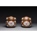 A pair of Chinese capucin-brown-ground famille rose covered bowls with floral design, Yongzheng/Qian