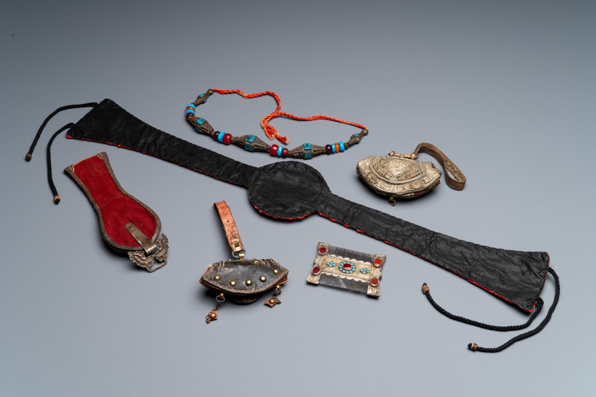 A group of six Tibetan objects of metals and textiles with gem stones and, 19th C. - Bild 3 aus 3