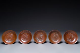 Five Chinese slip-decorated brown-glazed 'bird on blossoming plum tree' plates, Fujian kilns, late M