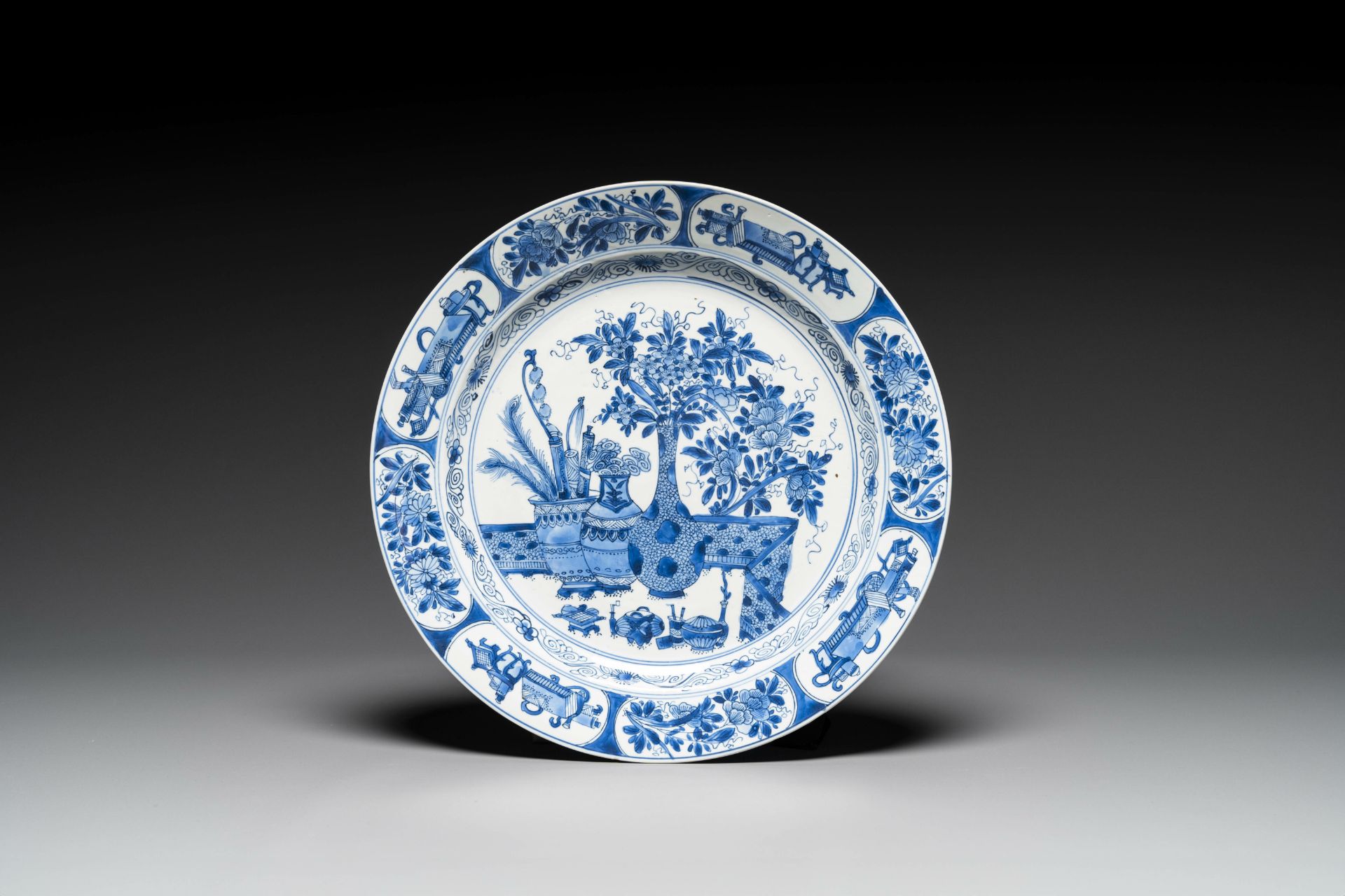 A Chinese blue and white 'antiquities' dish, Kangxi