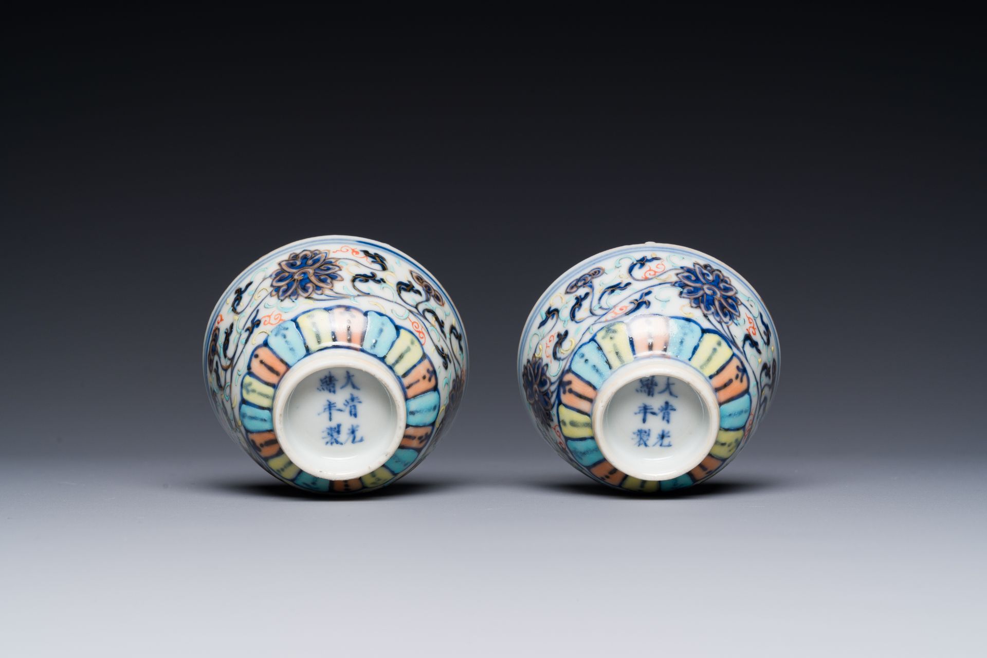 A pair of Chinese doucai 'lotus scroll' cups, Guangxu mark and of the period - Image 4 of 4