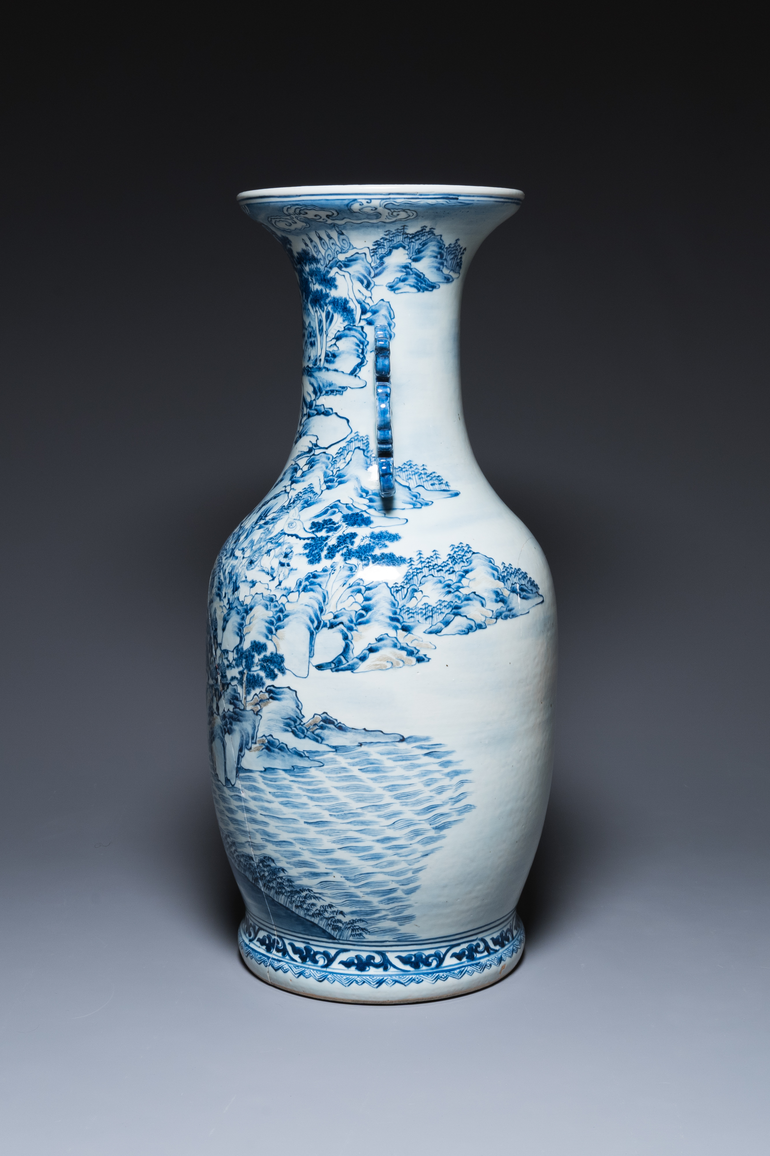 A large Chinese blue, white and copper-red vase with a mountainous river landscape, 19th C. - Image 4 of 6
