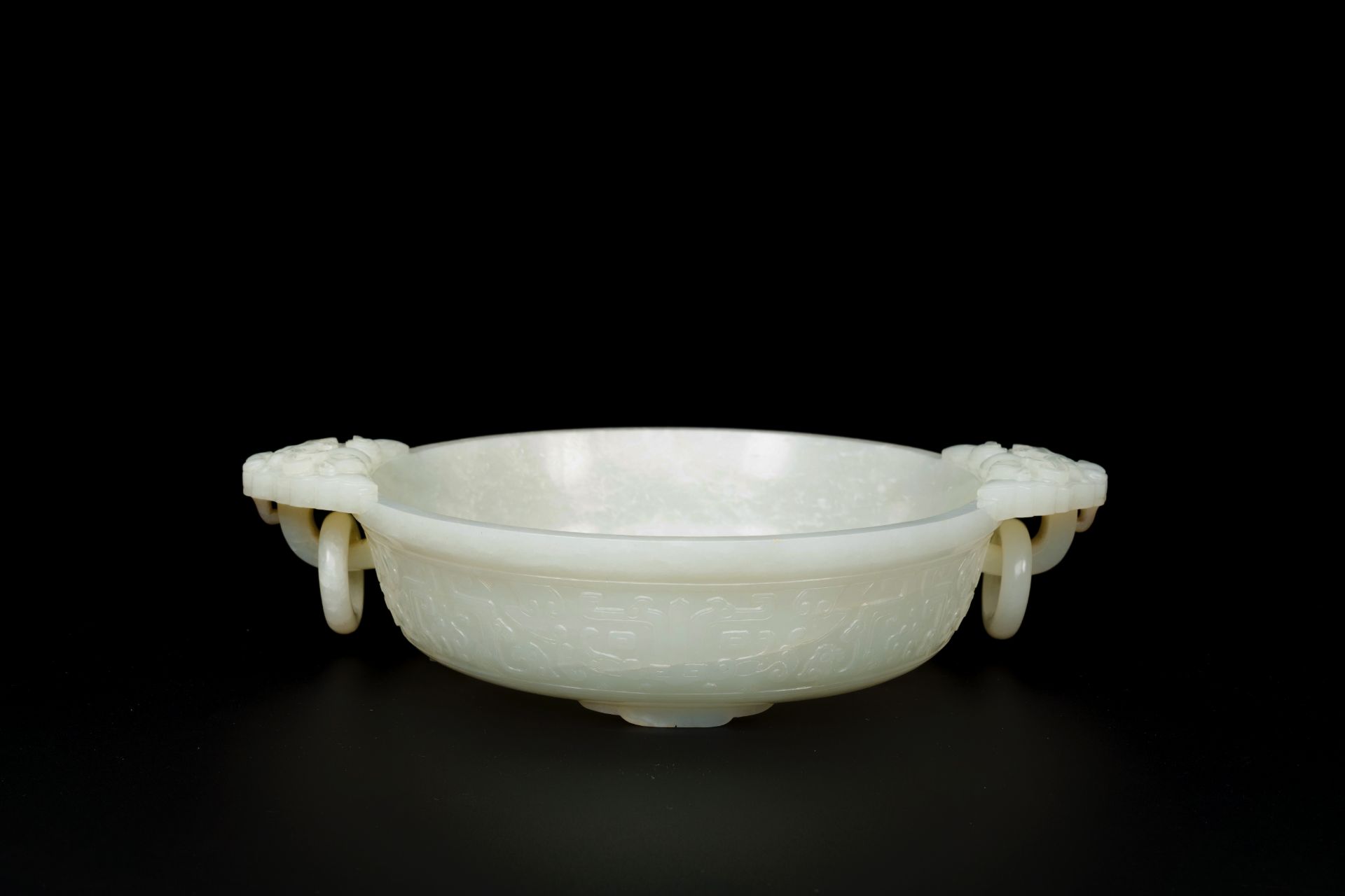 An important Chinese chrysanthemum-shaped very pale celadon jade marriage bowl, 18th C. - Image 6 of 8