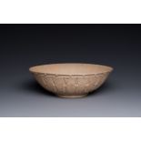 A large Chinese Yixing stoneware bowl with relief design, Qianlong mark, 18/19th C.