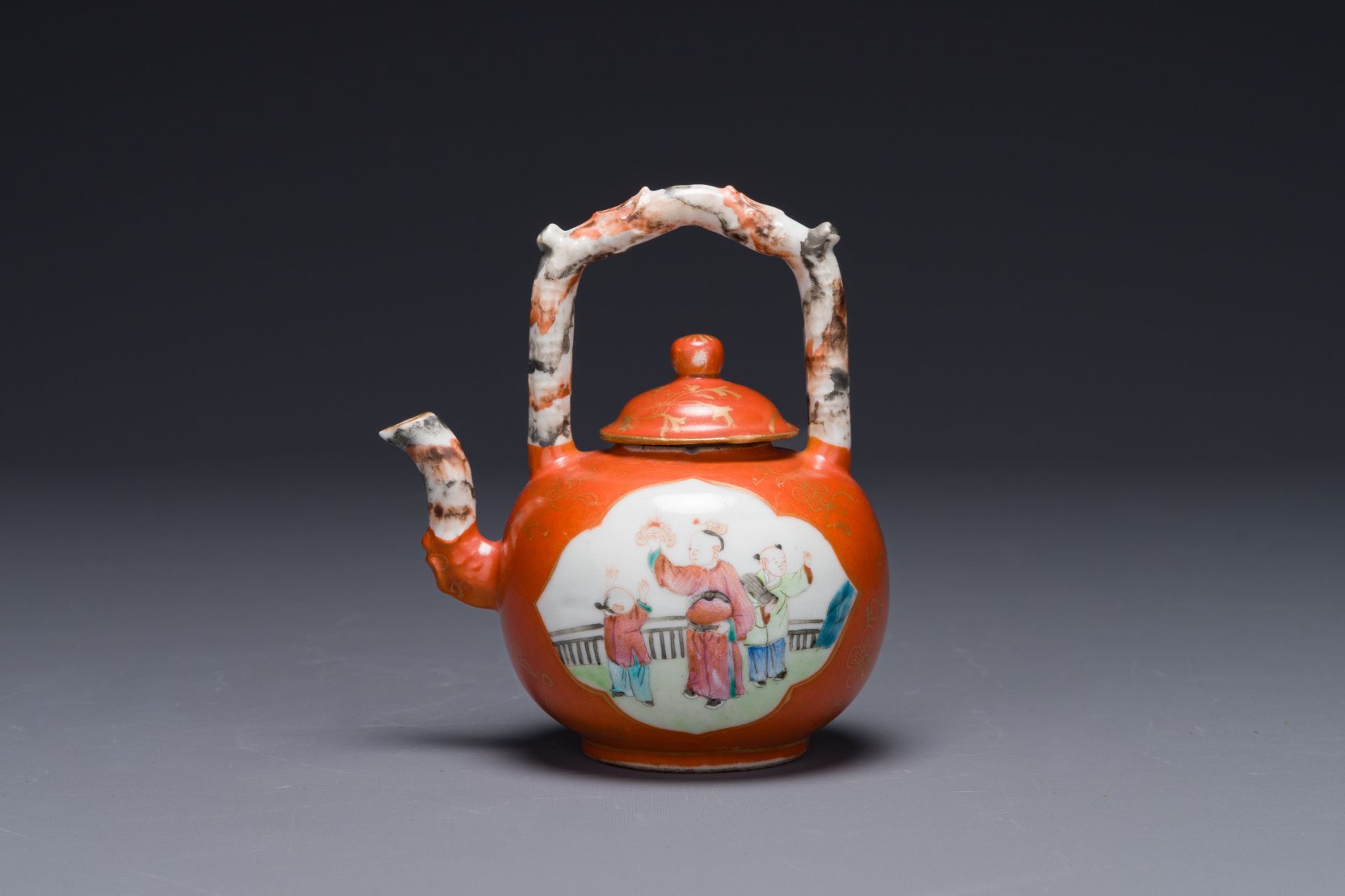 A Chinese famille rose coral-red-ground teapot with 'faux marbre' spout and handle, Jiaqing