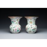 A pair of Chinese Canton famille rose spittoons with dragons, birds, butterflies and flowers, 19th C