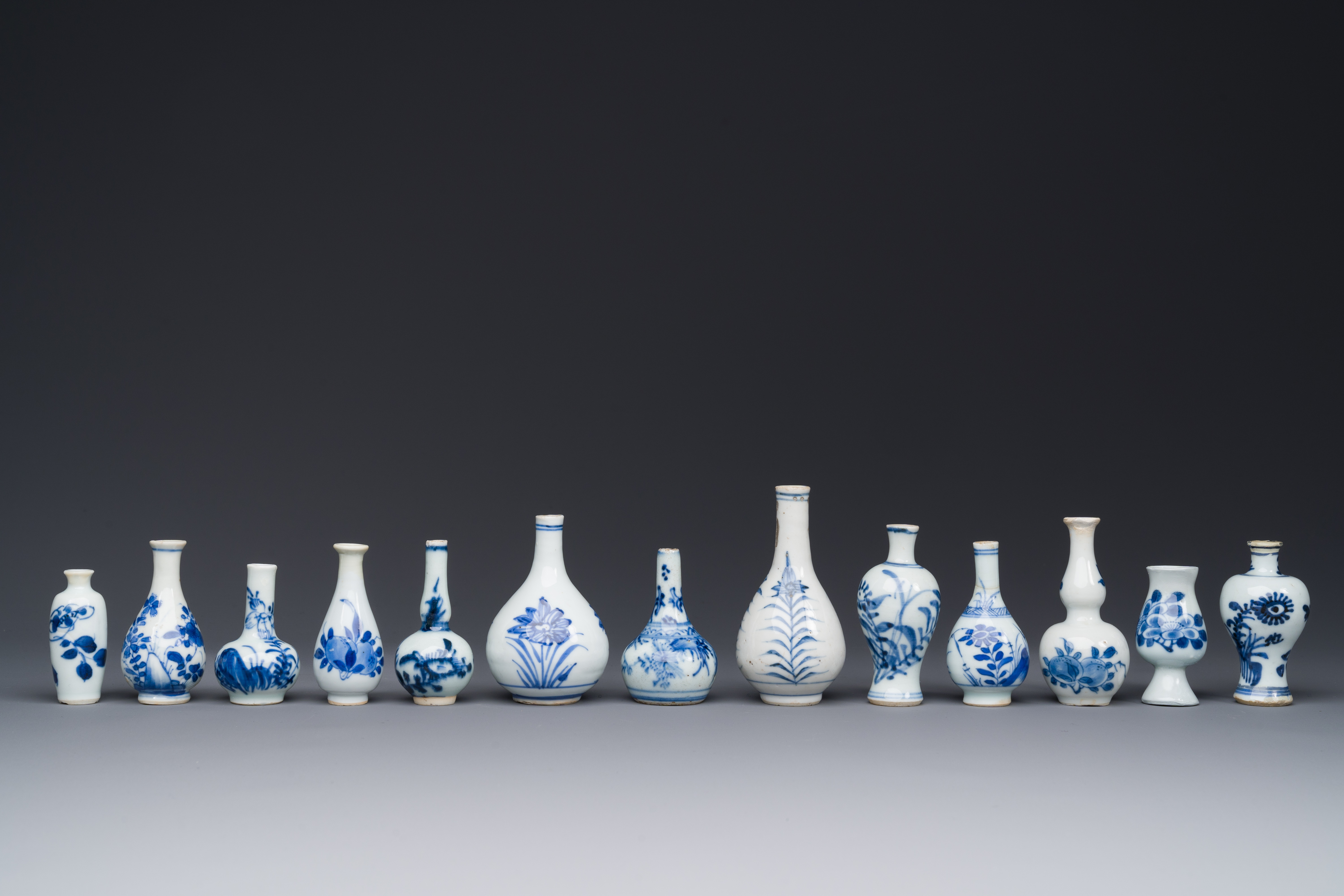 Thirteen Chinese blue and white miniature vases with floral design, Kangxi - Image 3 of 5