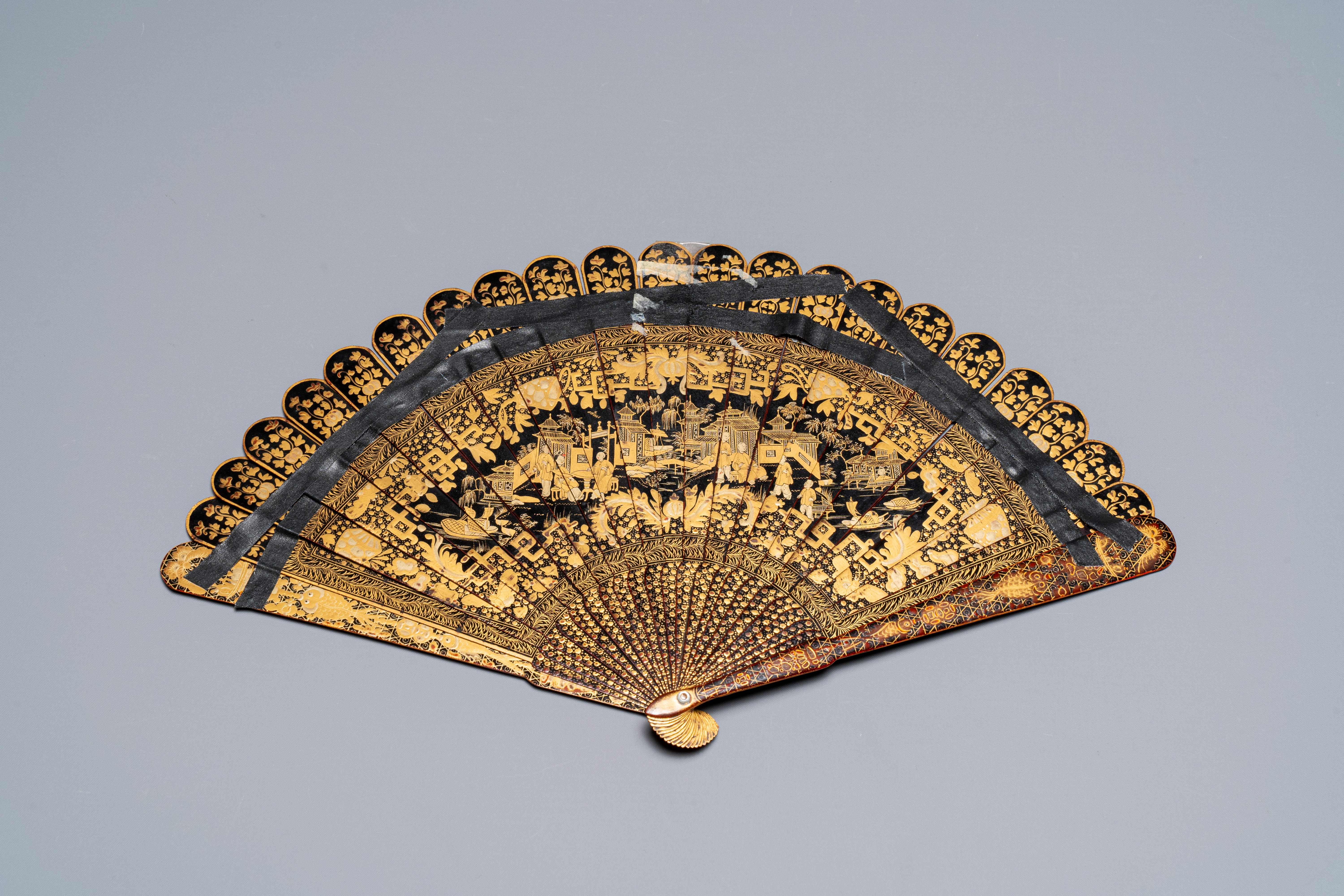 A large Chinese Canton gilt black lacquer tray, thee boxes and a fan, 19th C. - Image 5 of 17