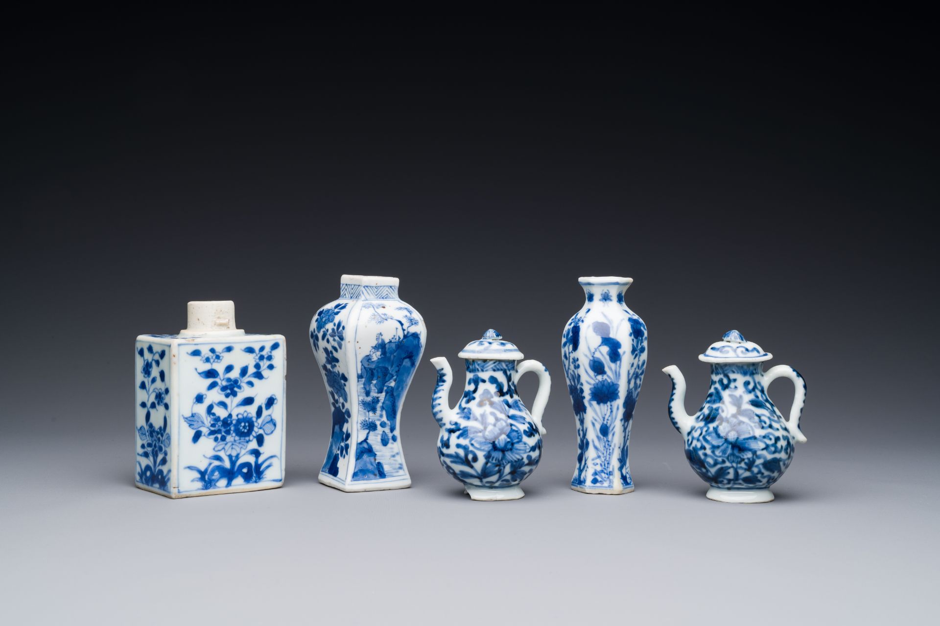 Two Chinese blue and white vases, two miniature jugs and a tea caddy, Kangxi