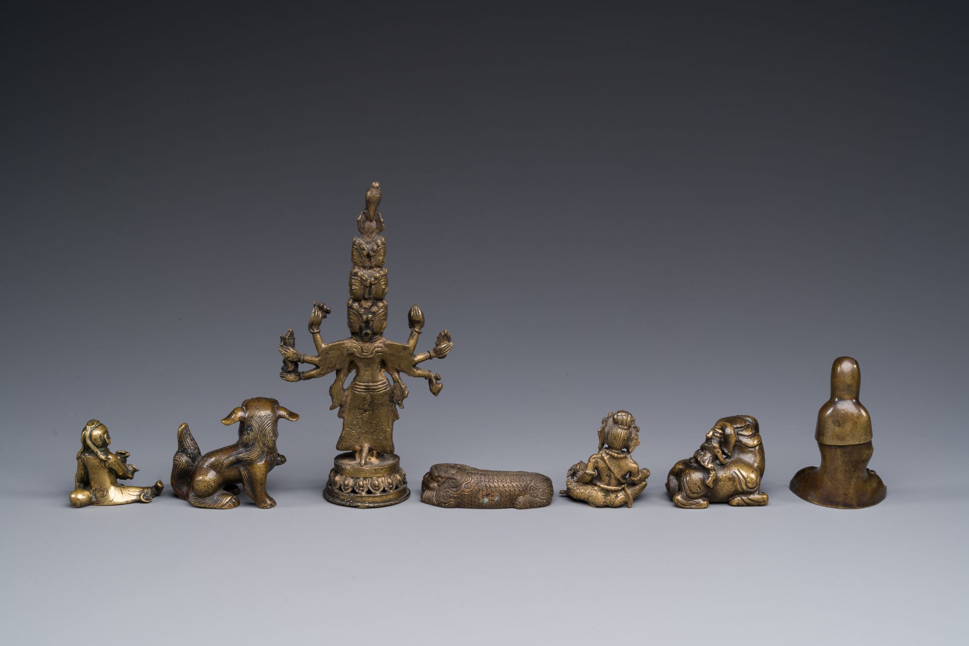 A collection of Chinese and Sino-tibetan bronze sculptures and paper weights, Qing - Image 3 of 4