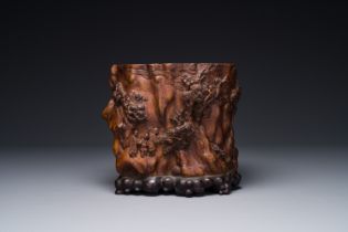 A large Chinese carved huanghuali wooden brush pot with Taoist design, 17/18th C.