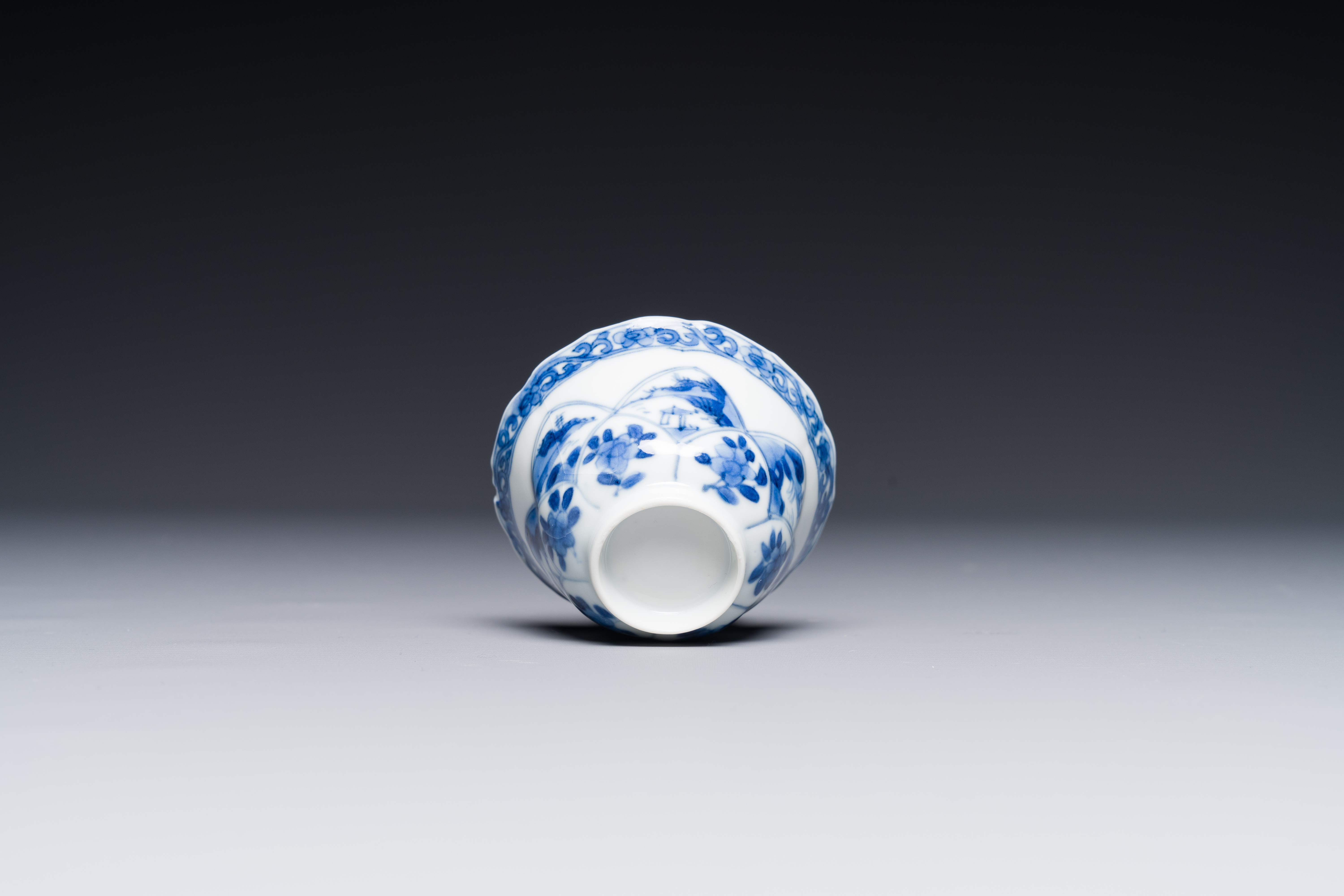 Four Chinese blue and white saucers and an 'erotic' cup, Kangxi - Image 7 of 7