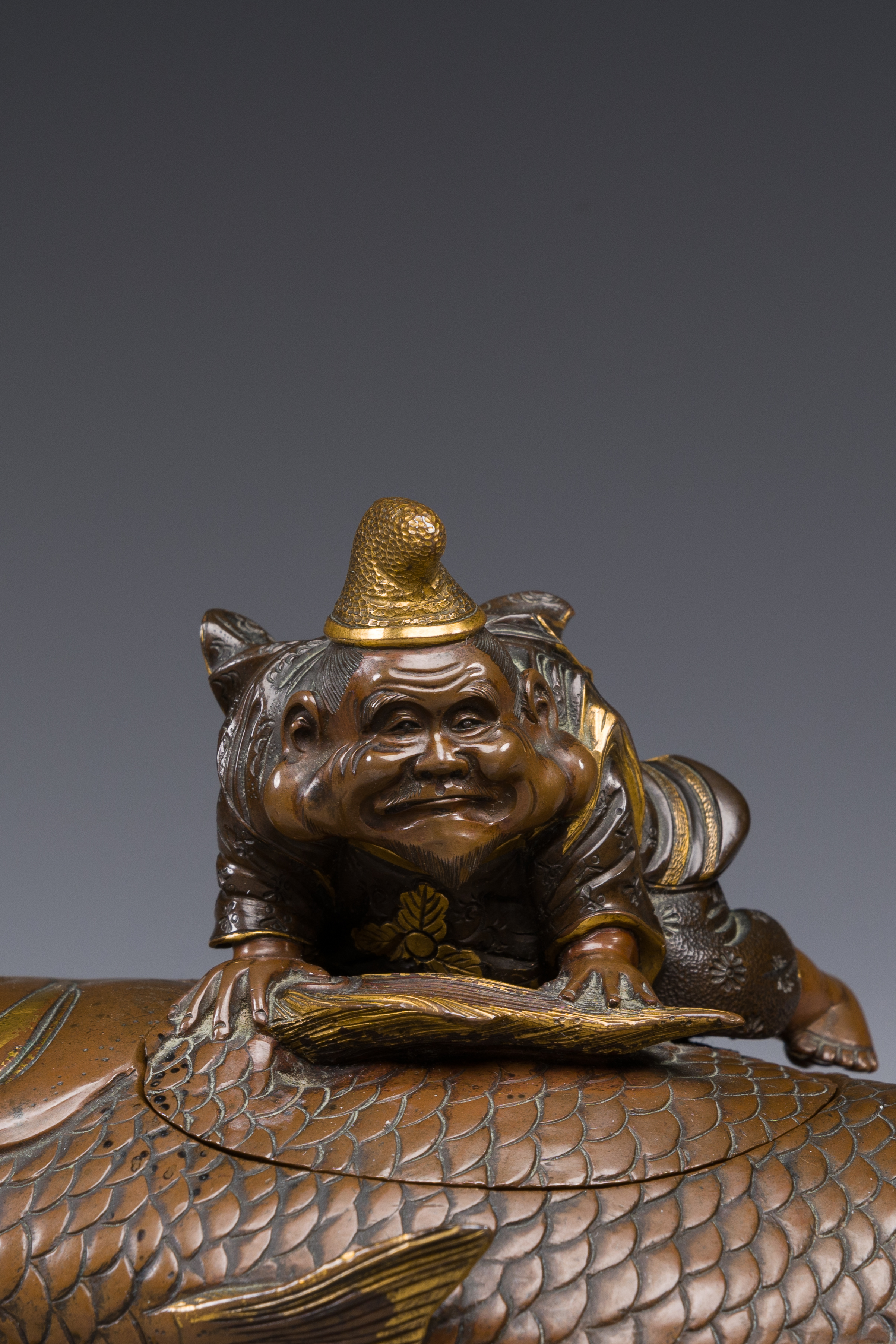 A Japanese partly gilded bronze lidded box in the shape of Ebisu on sea bream, signed Miyao Zo, Meij - Image 9 of 10