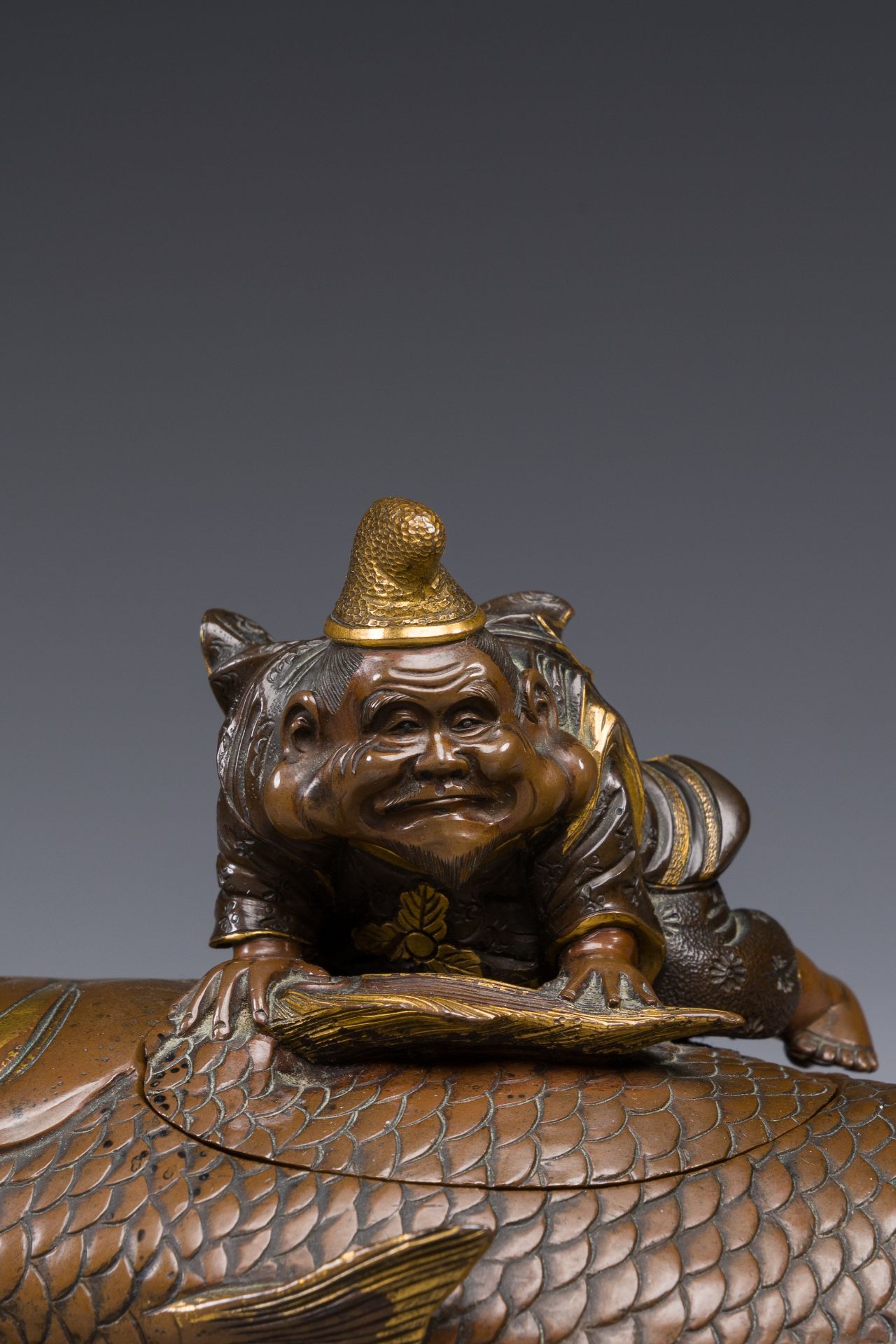 A Japanese partly gilded bronze lidded box in the shape of Ebisu on sea bream, signed Miyao Zo, Meij - Image 9 of 10