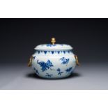 A Chinese blue and white covered bowl with floral design and gilt bronze mounts, Transition period