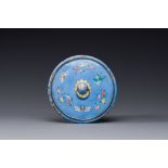 A Chinese Canton enamel circular hand mirror, early 19th C.