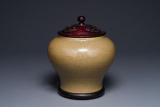 A Chinese ge-type pot with wooden lid and stand, 19th C.