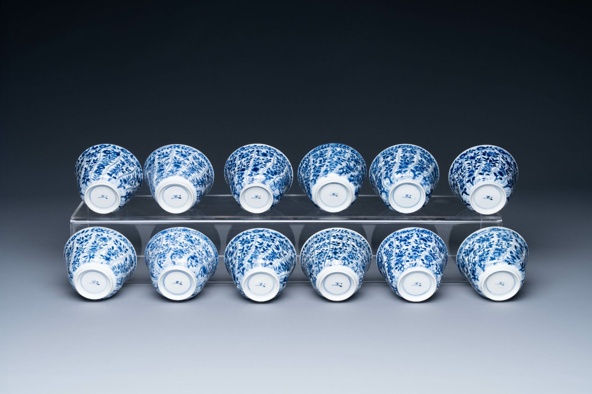 Twelve Chinese blue and white cups and saucers with floral design, jade mark, Kangxi - Image 7 of 7