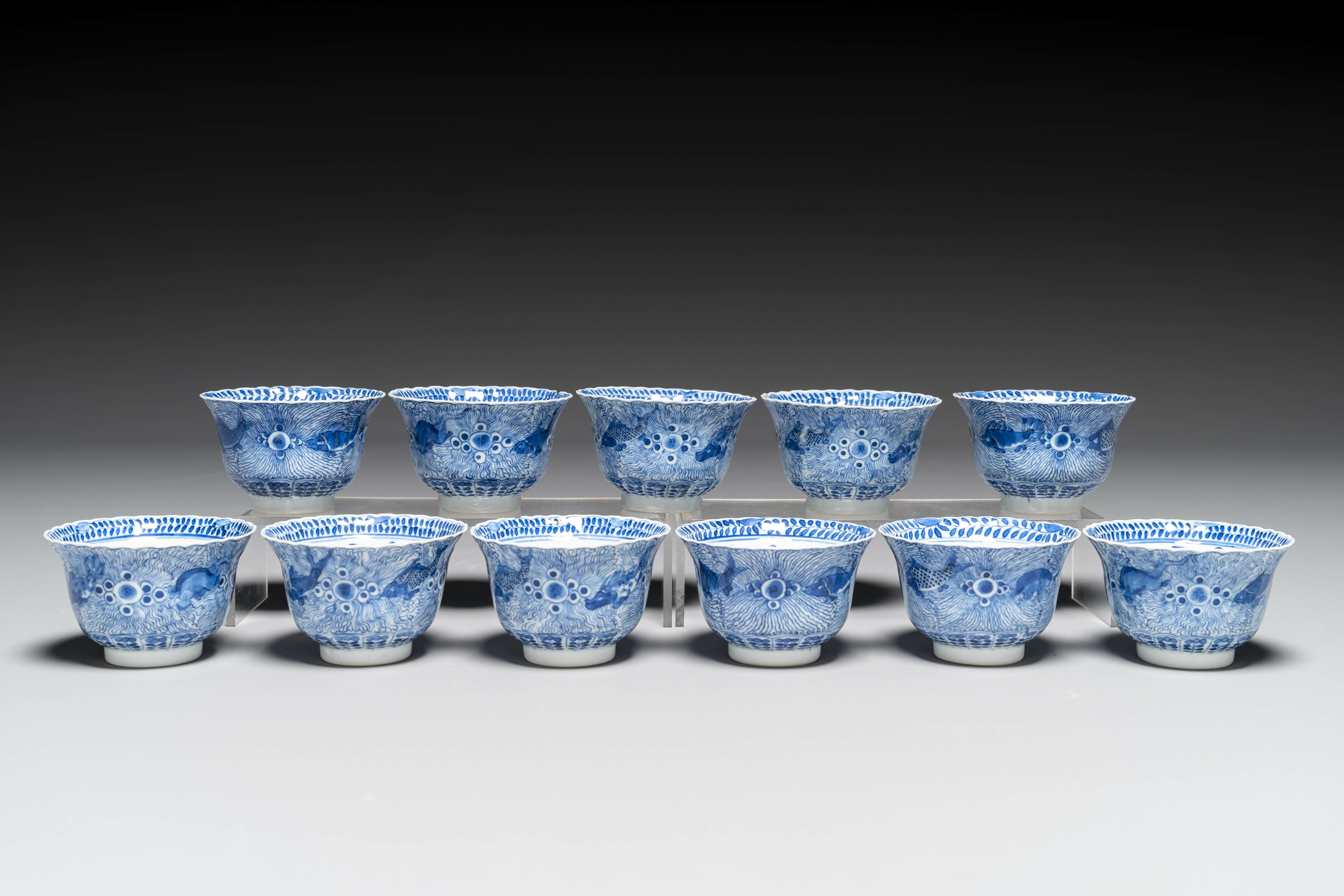 Eleven Chinese blue and white 'crab and fish' cups and saucers, Kangxi mark, Guangxu - Image 2 of 7