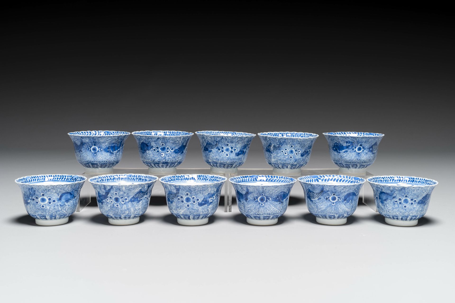 Eleven Chinese blue and white 'crab and fish' cups and saucers, Kangxi mark, Guangxu - Image 2 of 7