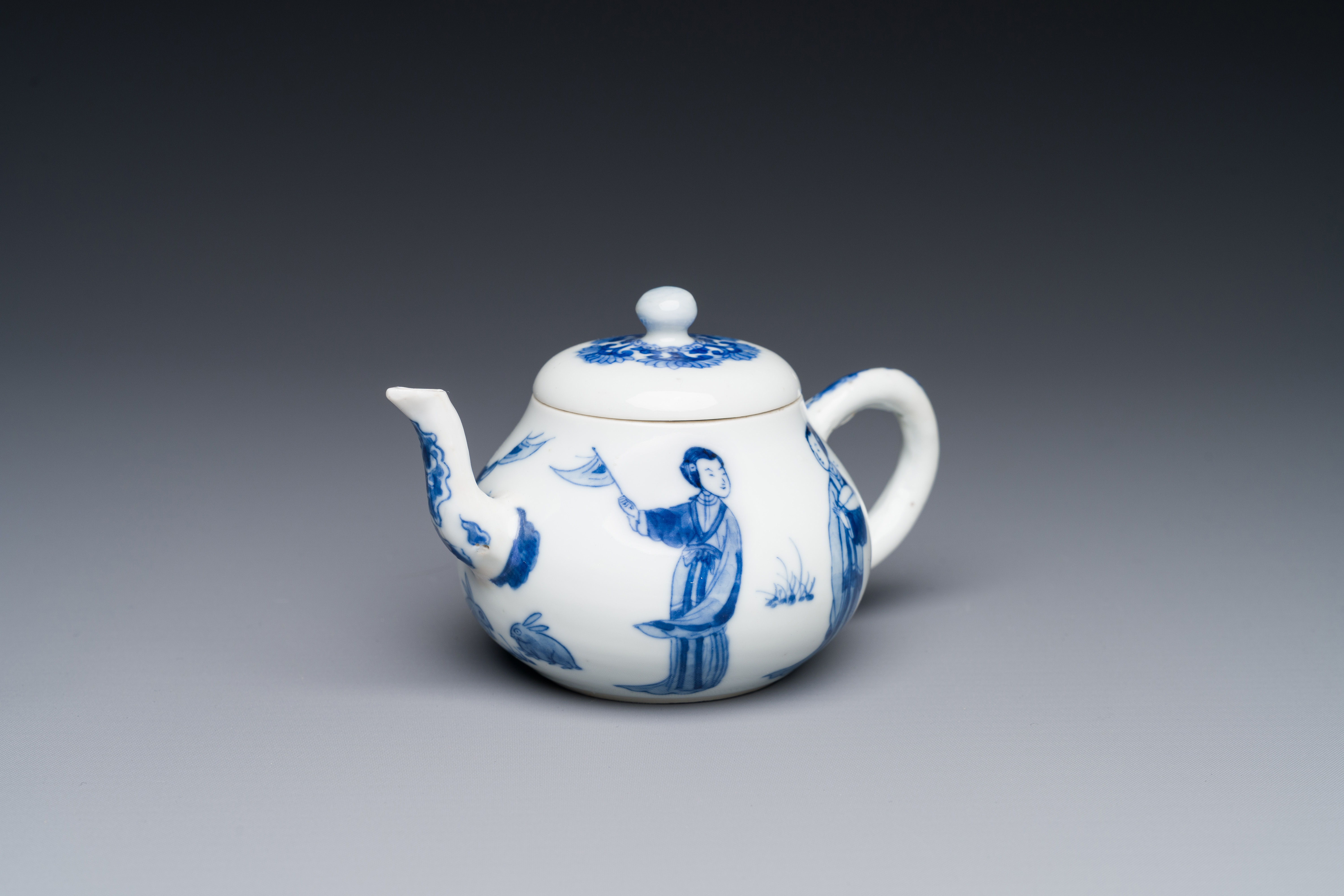 A Chinese blue and white 'Long Eliza' teapot and cover, Chenghua mark, Kangxi