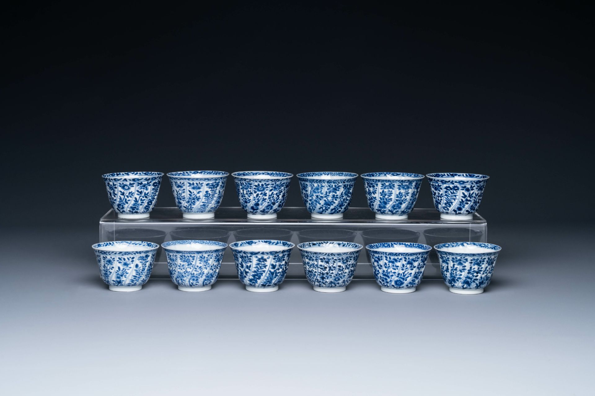 Twelve Chinese blue and white cups and saucers with floral design, jade mark, Kangxi - Image 4 of 7