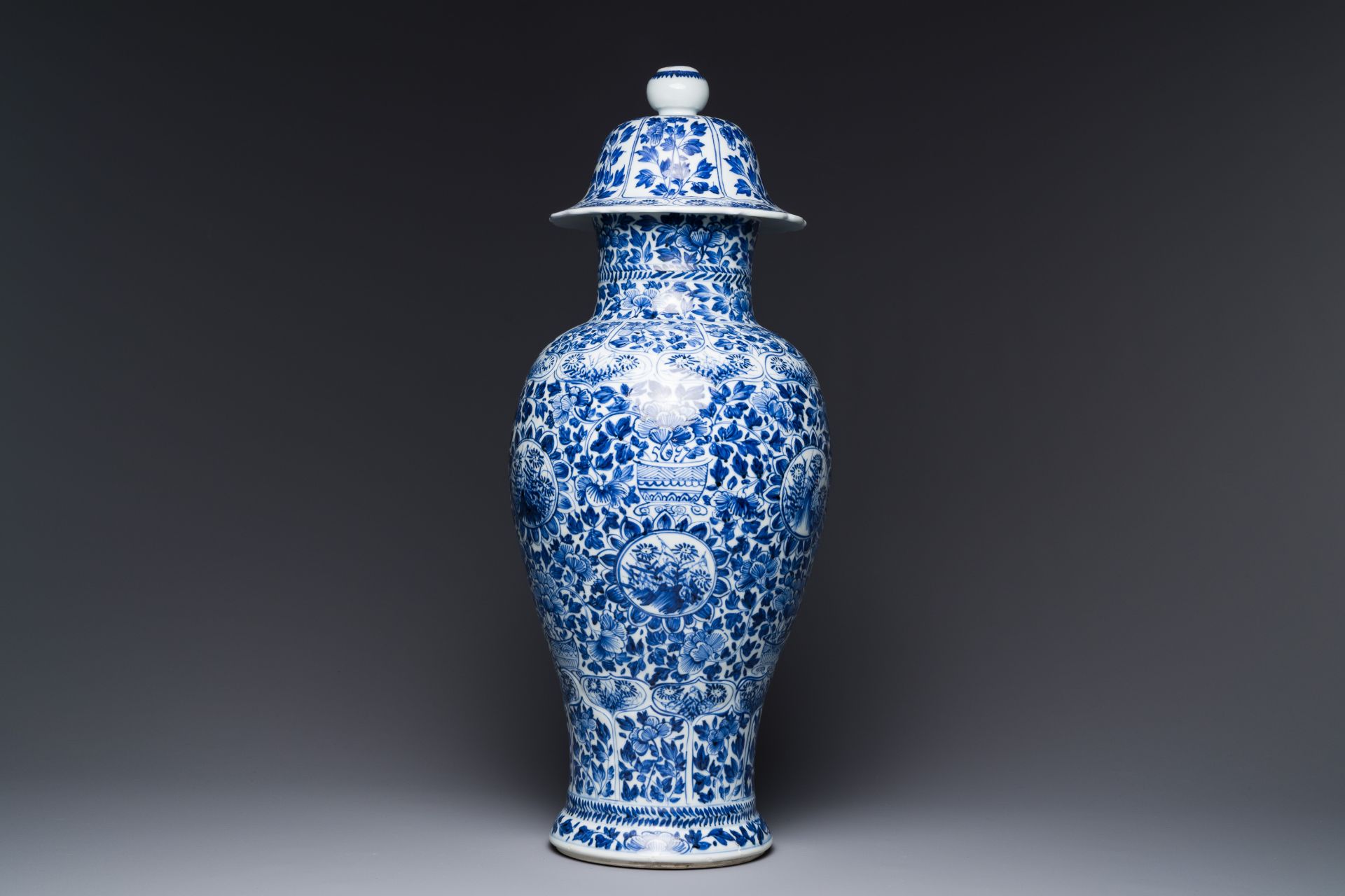 A Chinese blue and white vase and cover with floral design, Kangxi