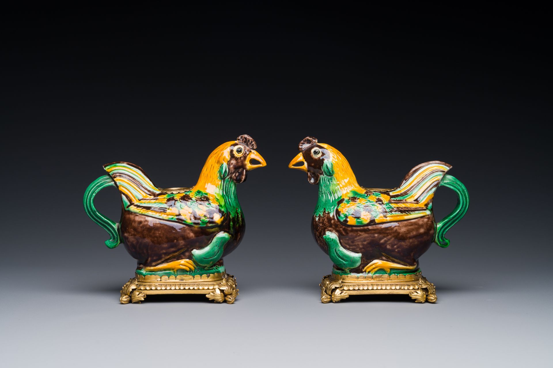 A pair of Chinese sancai-glazed chicken ewers mounted as candleholders with gilt bronze, Kangxi - Image 2 of 4
