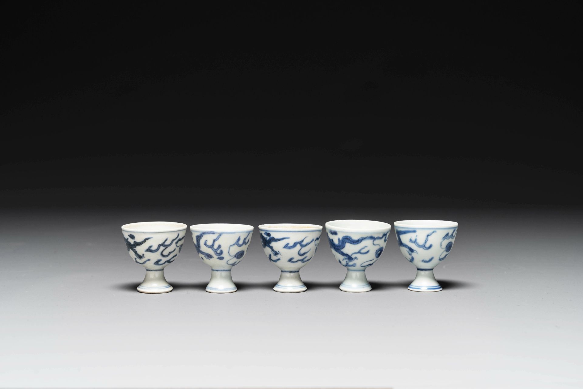 Five Chinese blue and white 'Hatcher cargo' stem cups with dragons, Transitional period - Image 2 of 5