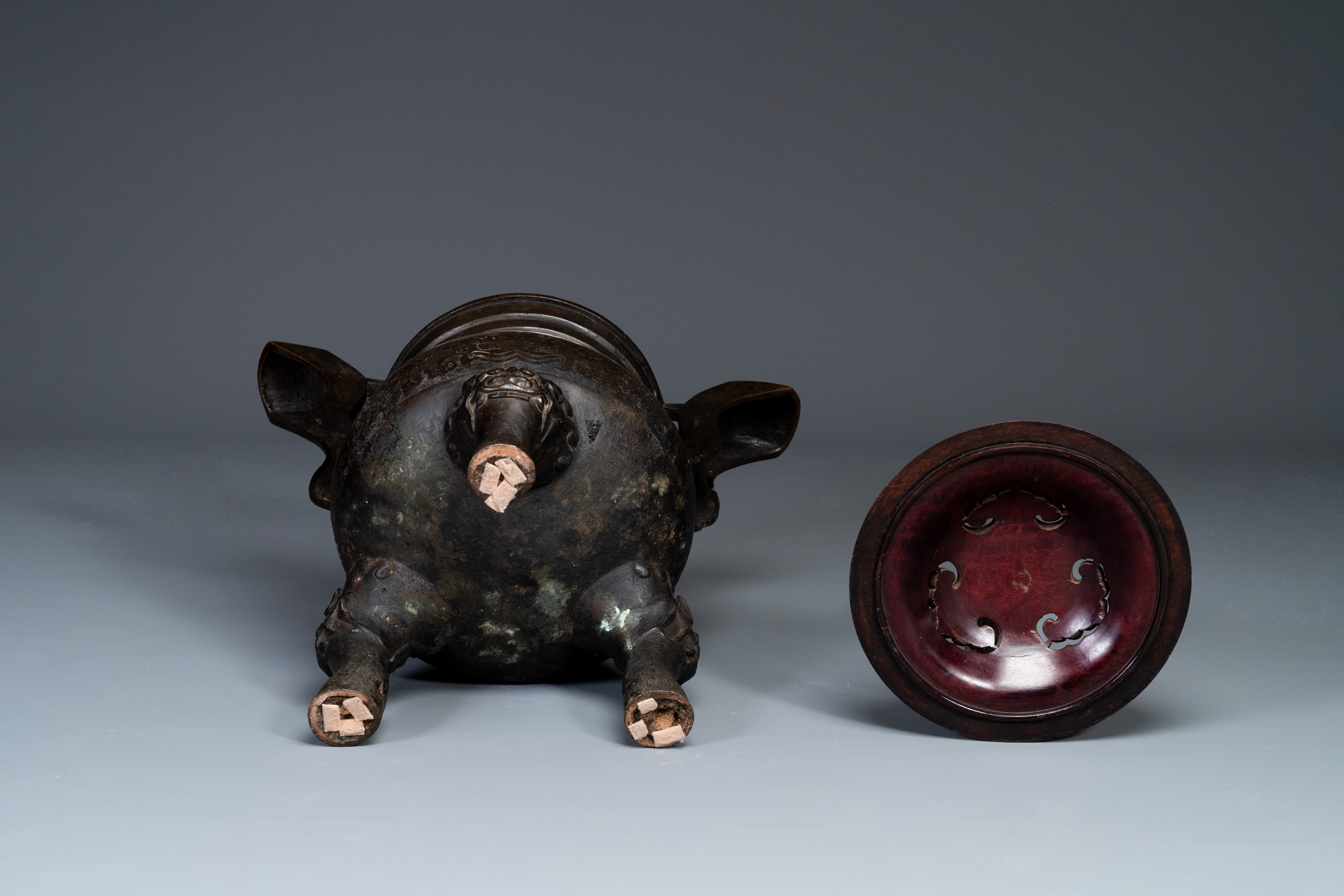 An important Chinese bronze tripod 'taotie' censer with wooden lid, Ming - Image 16 of 18