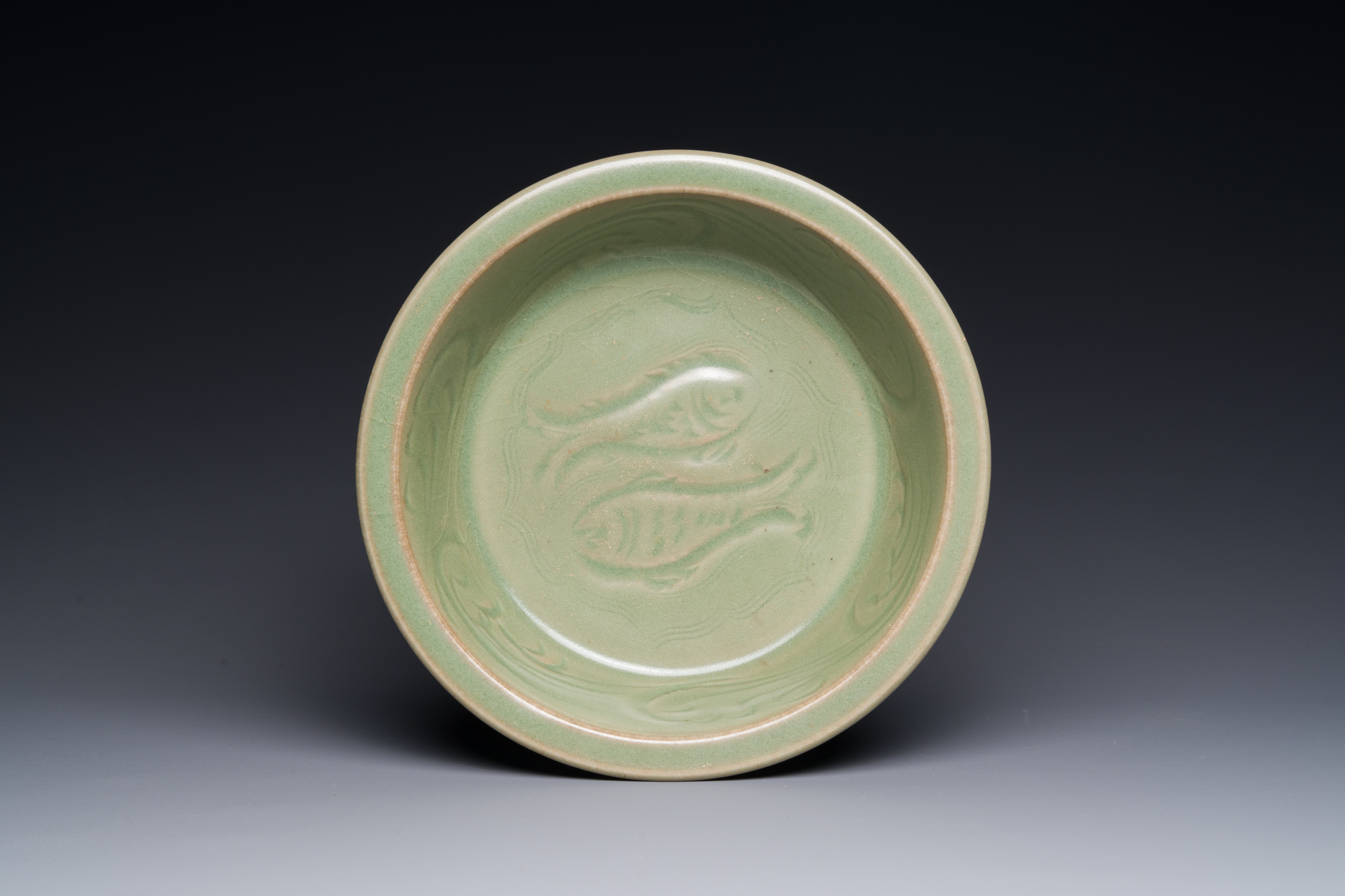 A Chinese Longquan celadon brush washer with anhua 'fish' design, Yuan/Ming