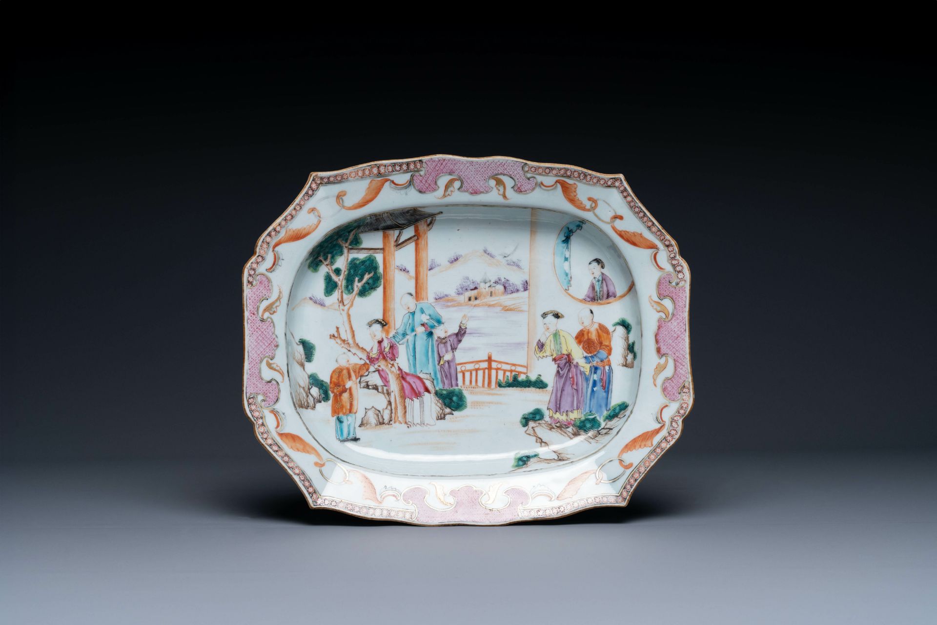 A large octagonal Chinese famille rose 'mandarin subject' dish, Qianlong