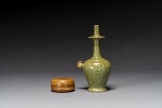 A Chinese yellow-glazed marbled covered box and a green-glazed marbled ewer, Tang/Song